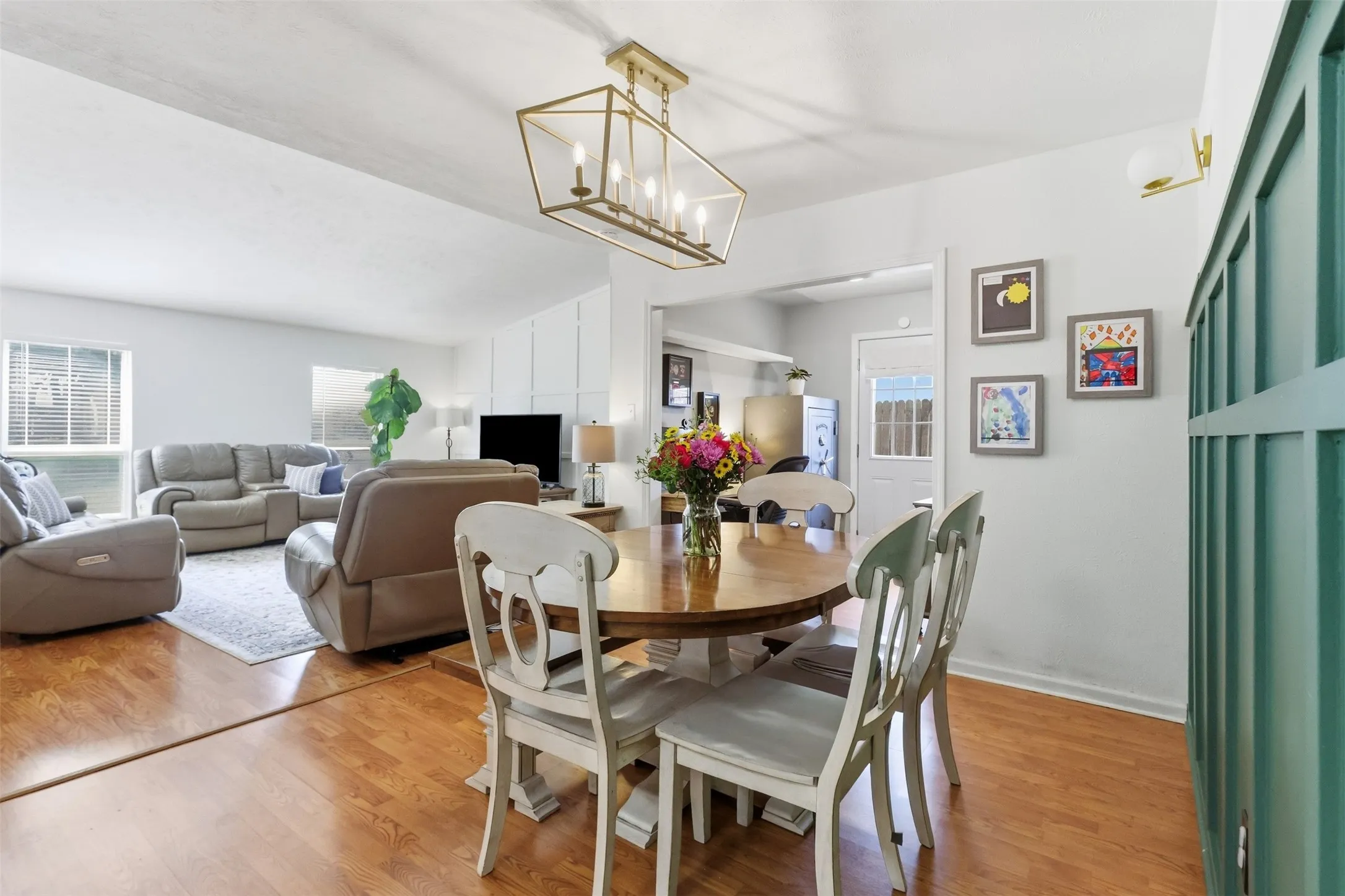 Dining Area — Open dining space with updated lighting and an easy connection to the living room.