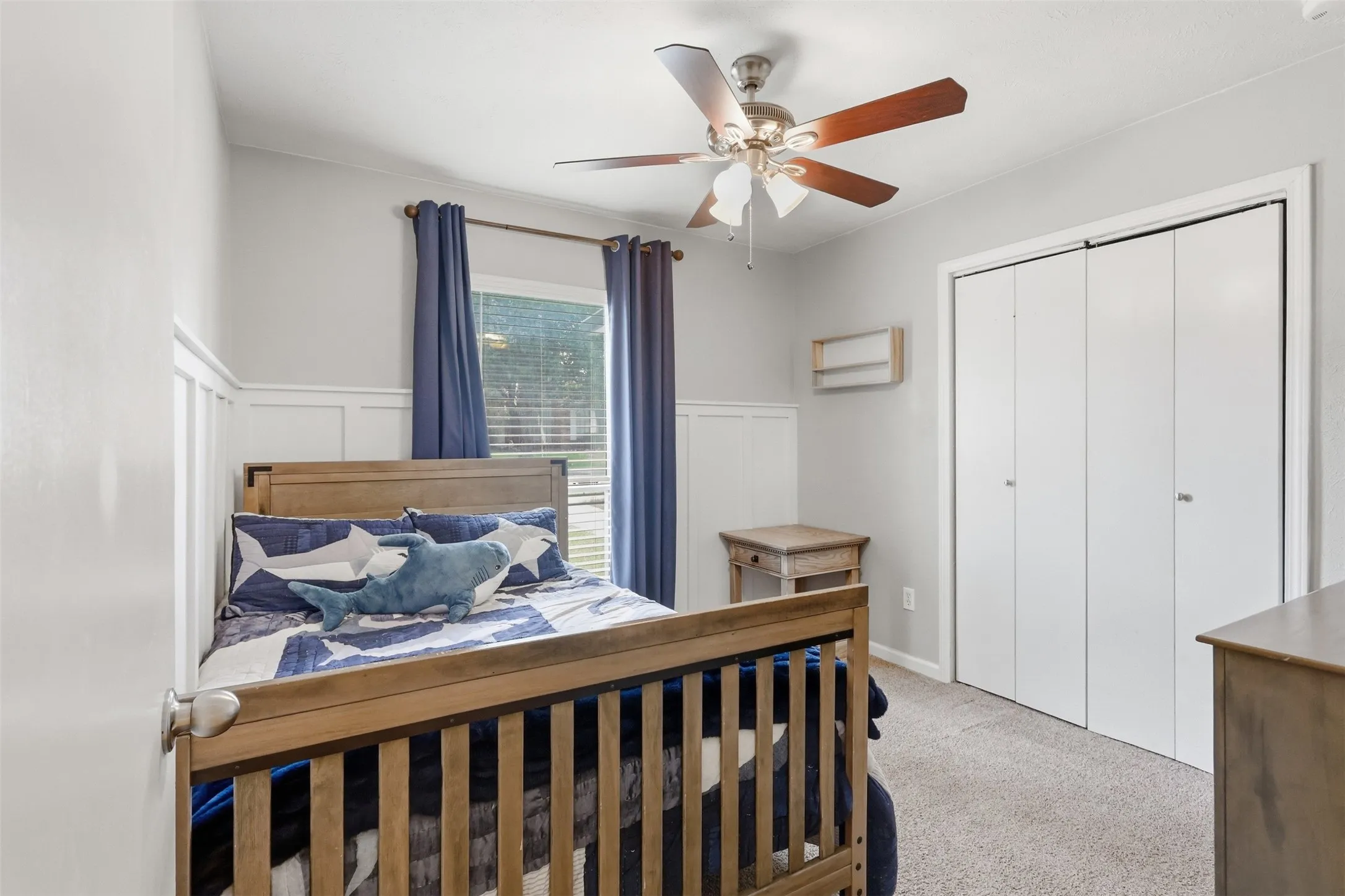 Comfortable secondary bedroom with good natural light and generous closet space.