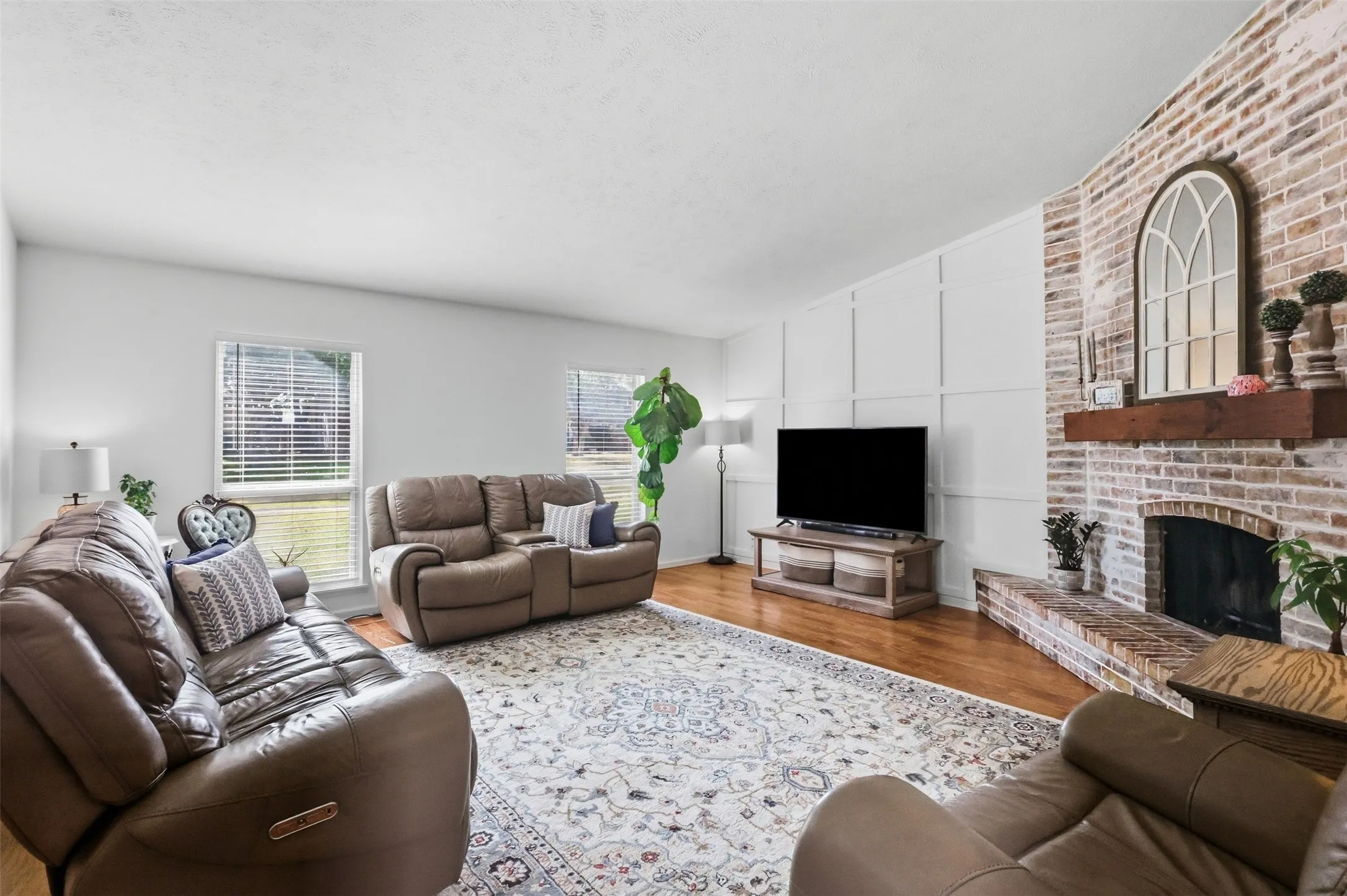 Inviting living room with fireplace focal point and seamless connection to the dining area.