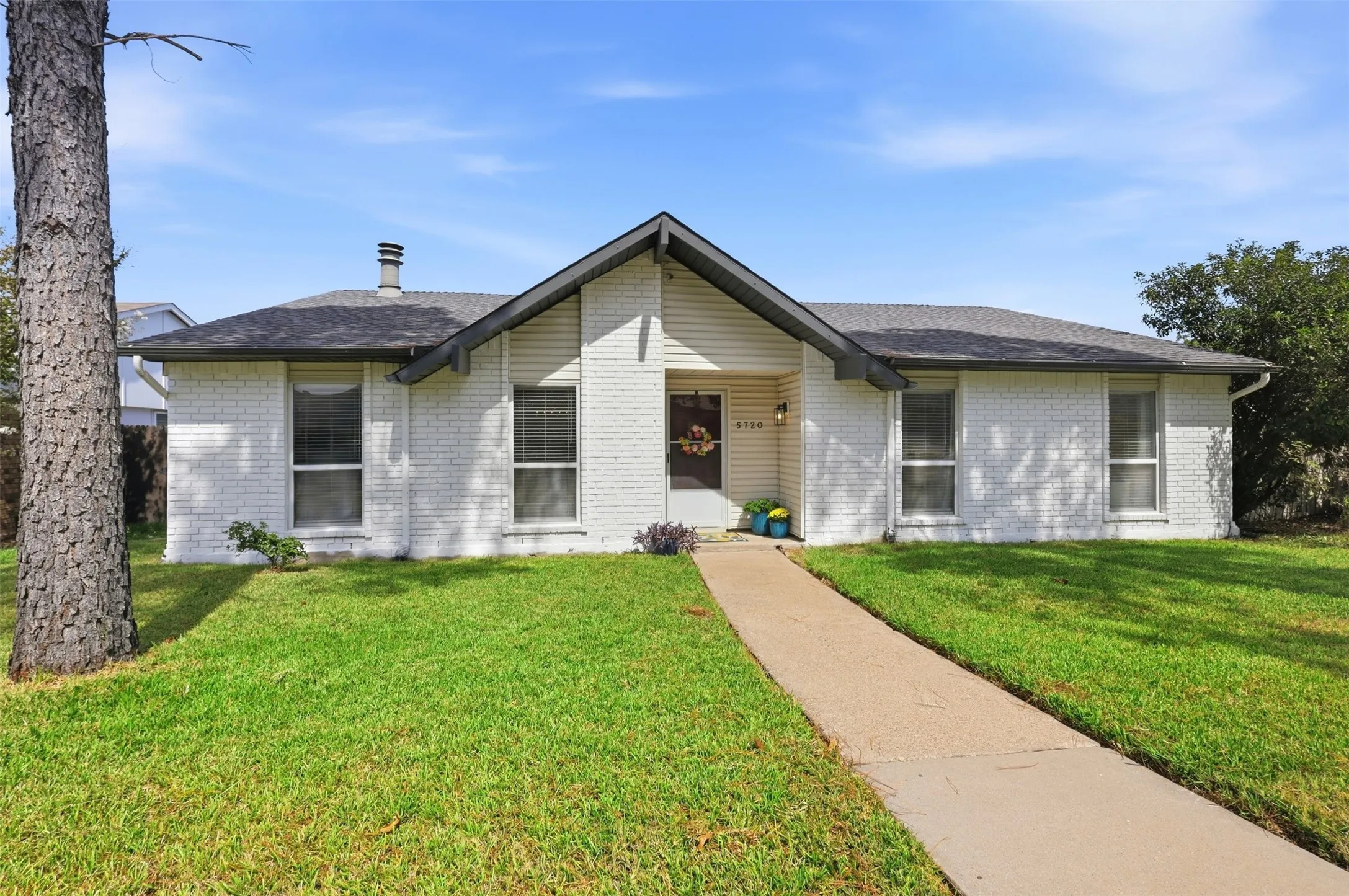 Charming single-story home situated on a desirable corner lot in The Colony.