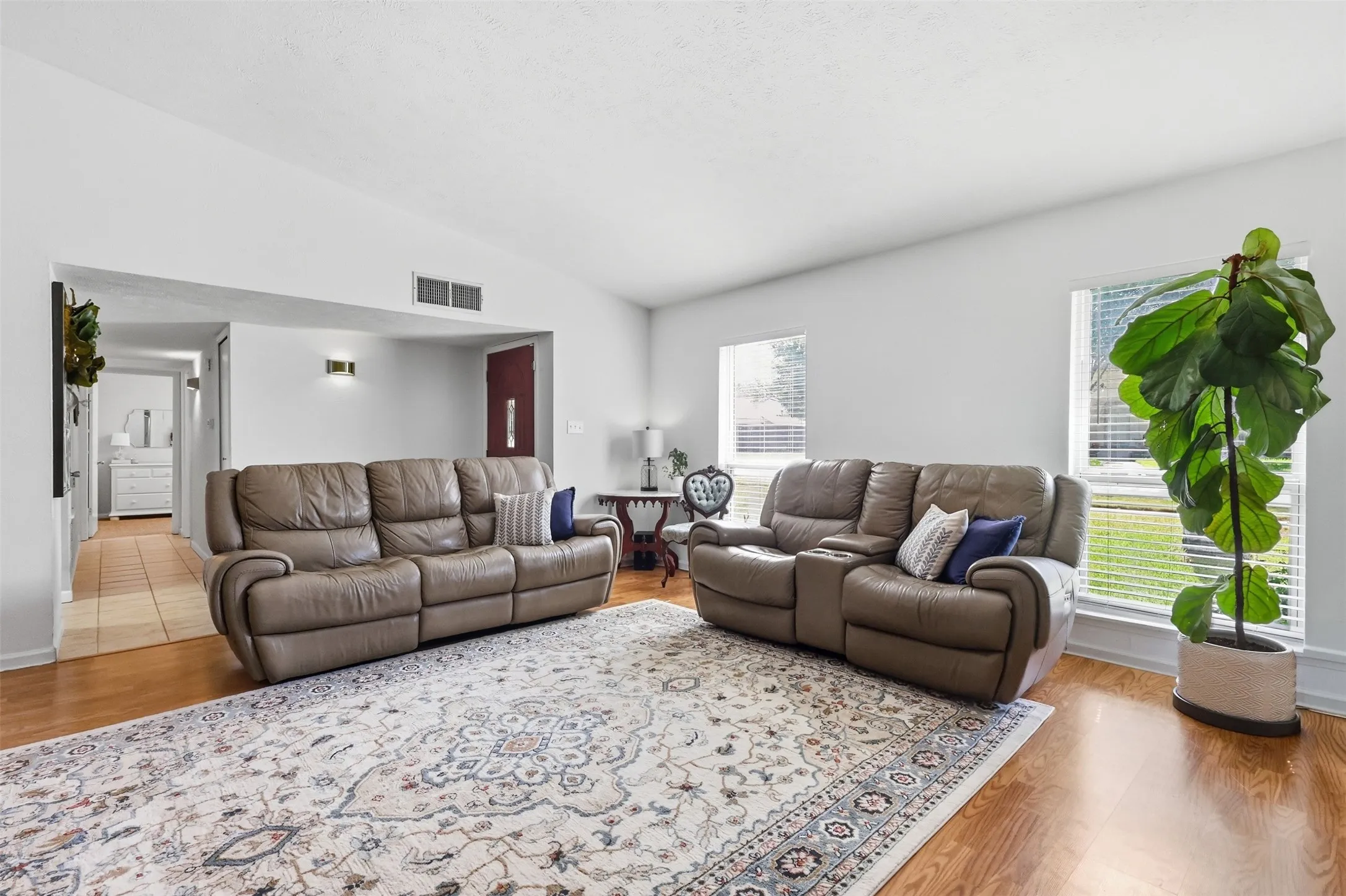 Another view of the main living area showcasing its size, natural light, and open feel.