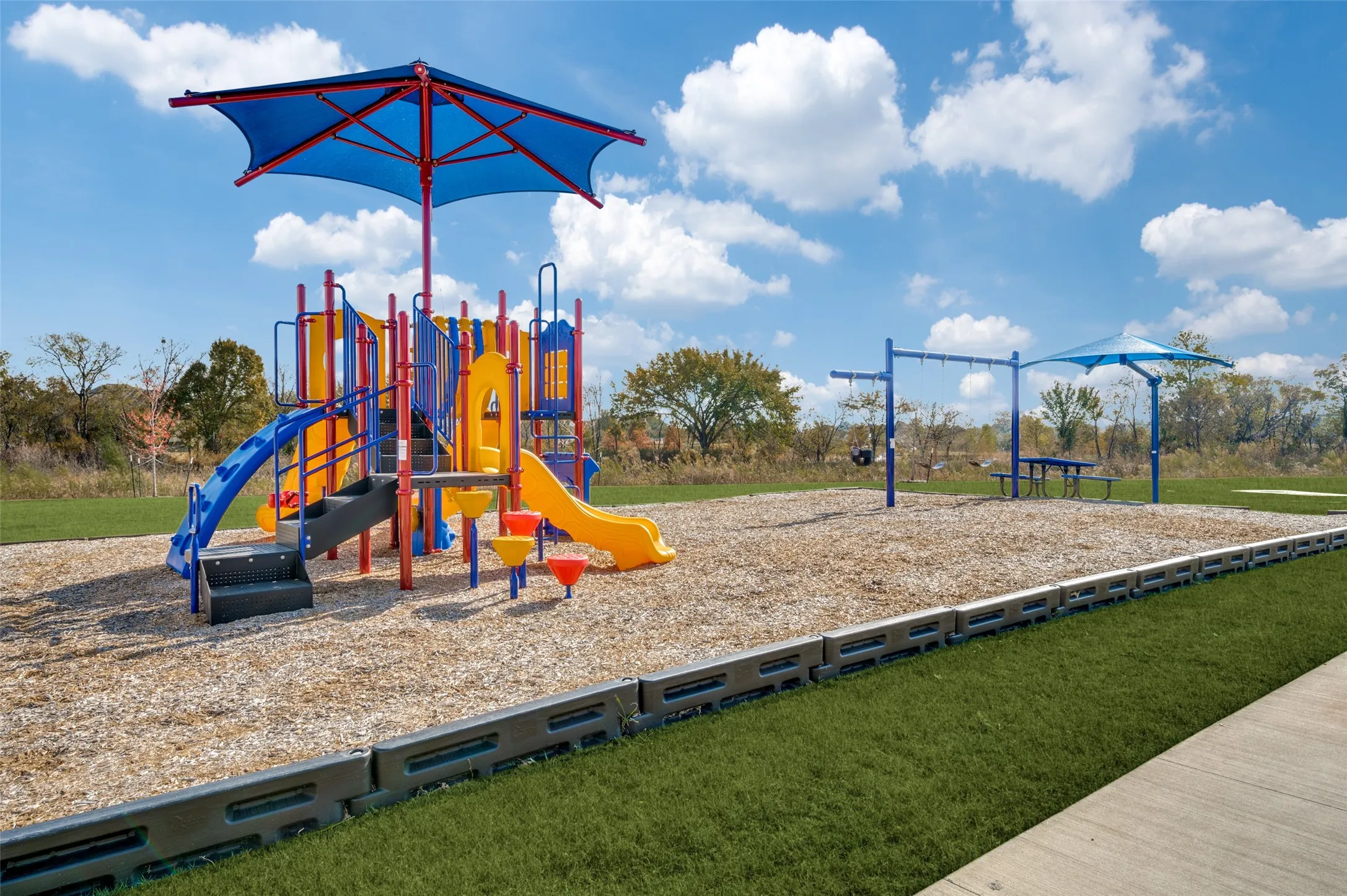 Enjoy the community’s inviting neighborhood park, featuring a colorful playground, swings, shaded seating areas, and plenty of open green space. Surrounded by natural scenery, it’s the perfect place for outdoor play, family time, and enjoying the beautiful surroundings.