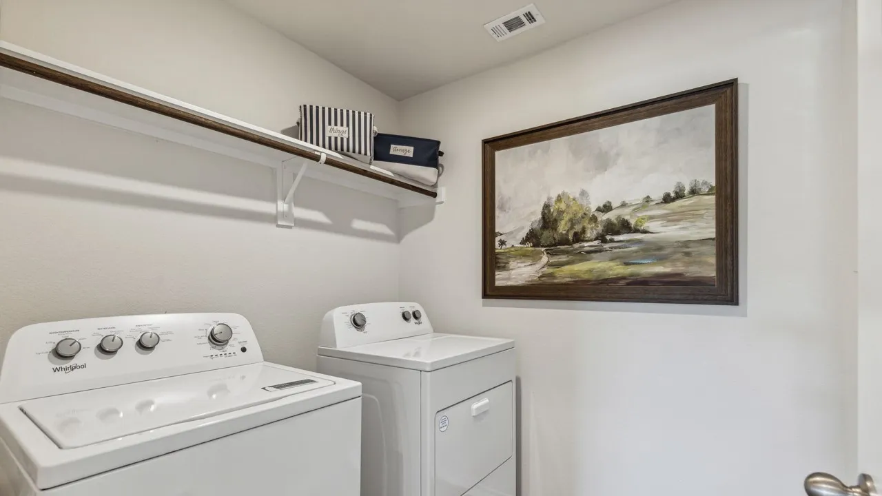 Laundry area featuring washing machine and clothes dryer