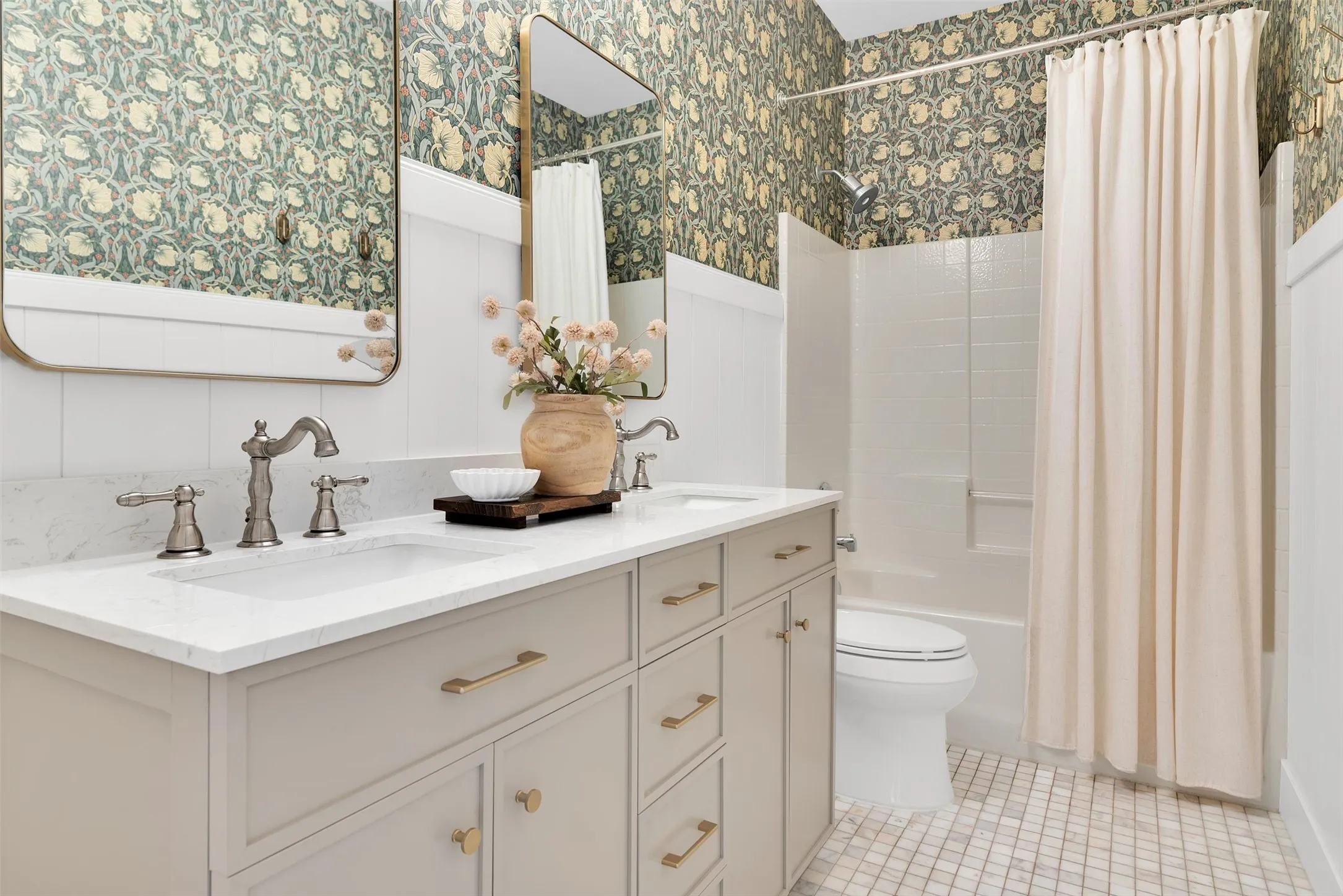 Double vanity with integrated sinks, brushed nickel faucets, and white quartz countertops