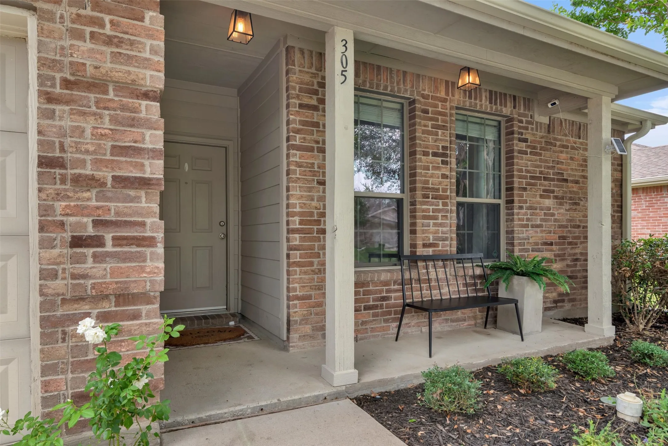Brick veneer exterior with a covered entry