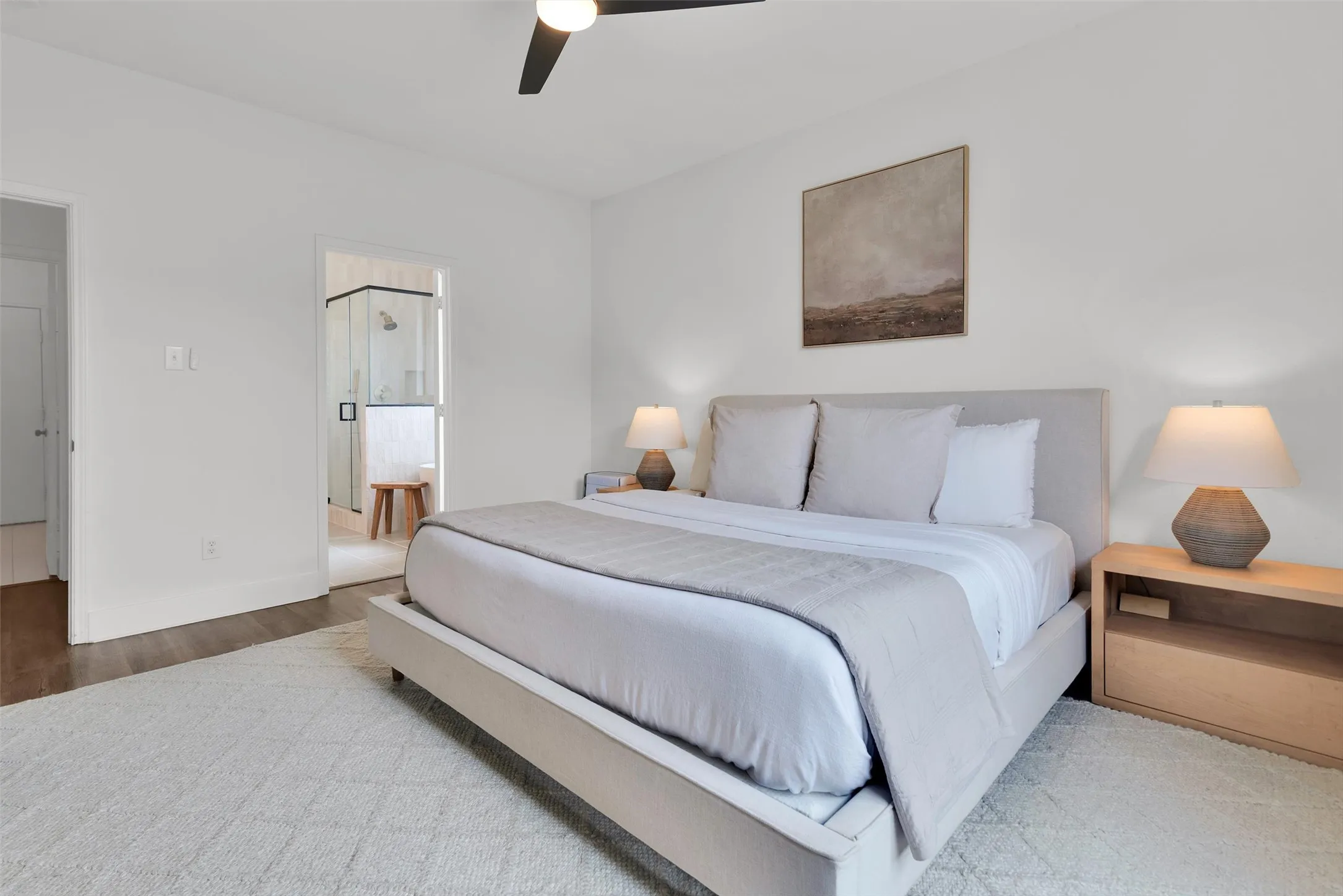 Recessed lighting, wood-finish flooring, and a contemporary ceiling fan