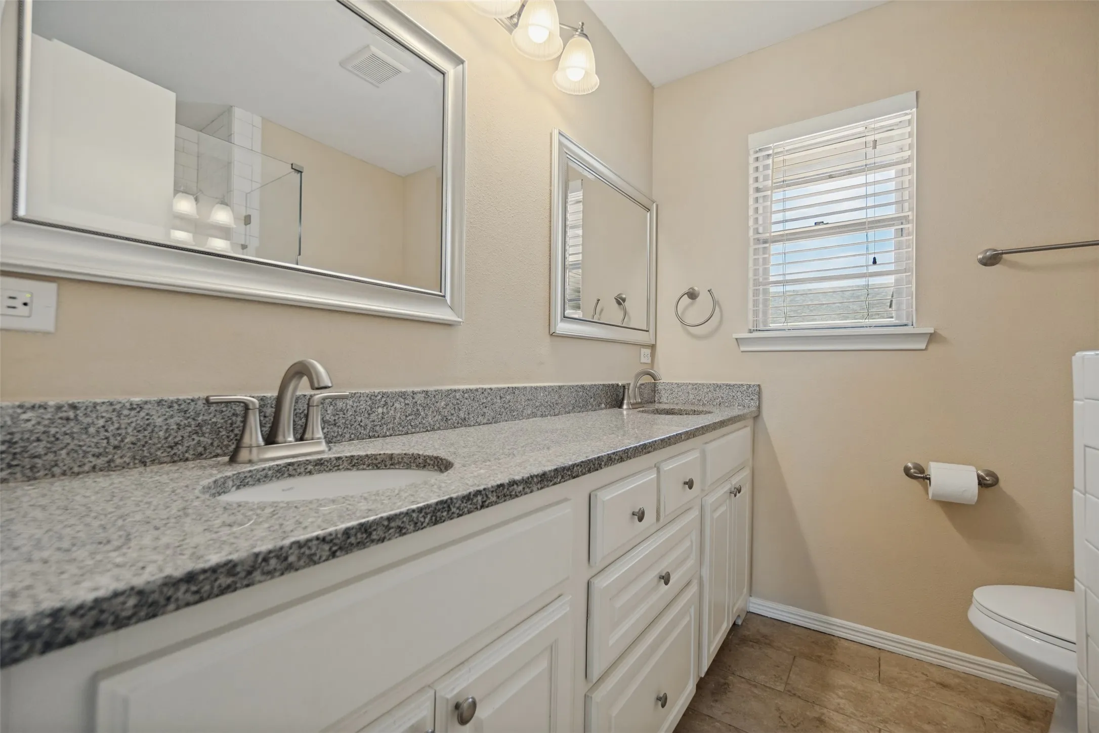 Granite counters dual sinks.