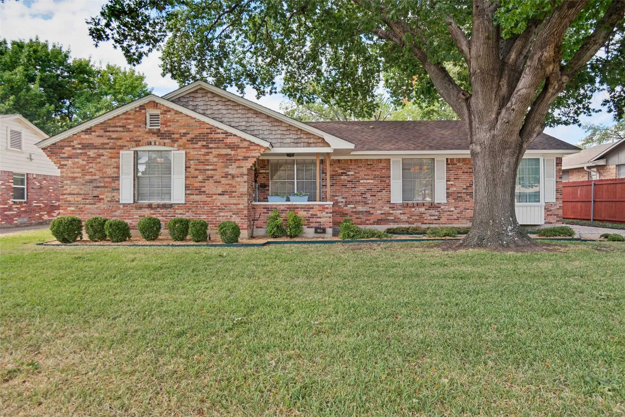 Large yard with beautiful shade trees.