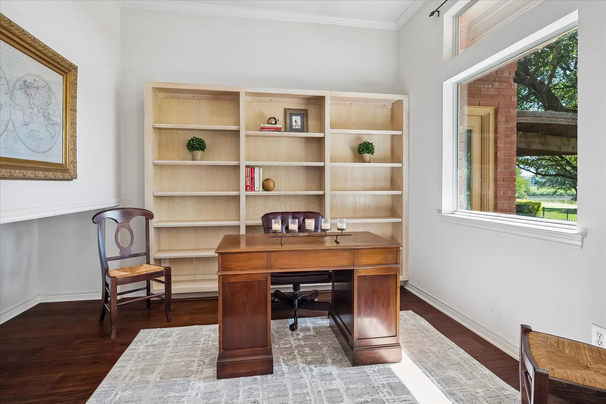 Built-in shelving, American Hickory wood floors, and a large picture window to enjoy the golf views
