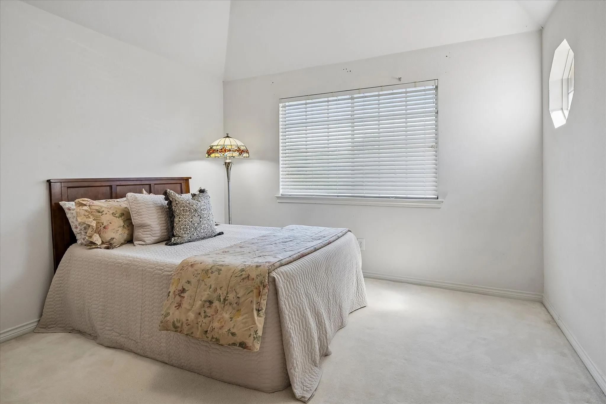 Second guest room up with cushioned ceiling, extra octagonal window to golf views, walk in closet and en suite bath