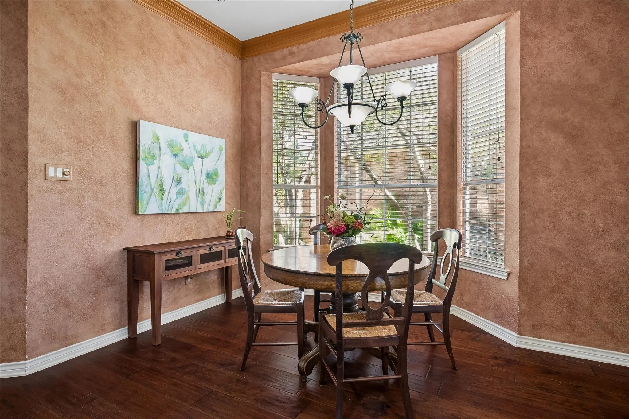 Beautiful bay window lets in just the right amount of light, iron chandelier