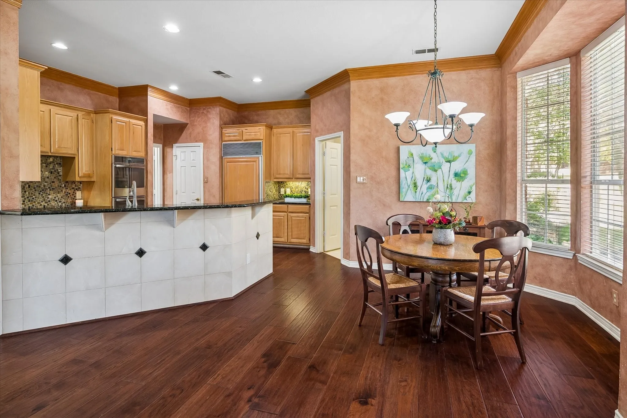Breakfast bar with tile facade to eliminate scratches on bare walls.  There is plenty of extra seating space available