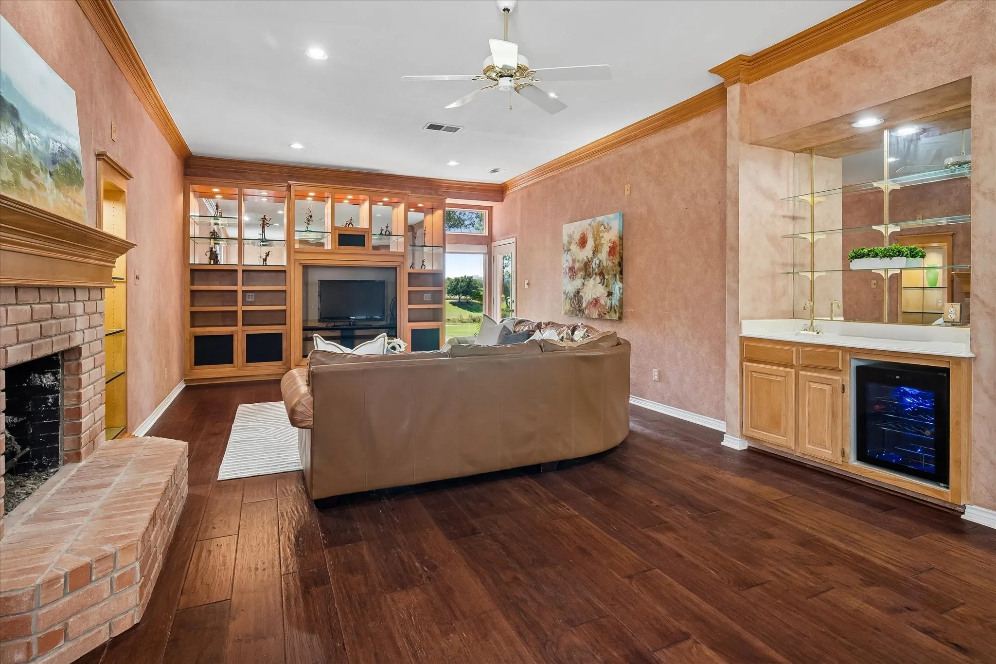 Gorgeous floors set off this room made for viewing TV with little glare, complete with a wet bar or beverage center.
