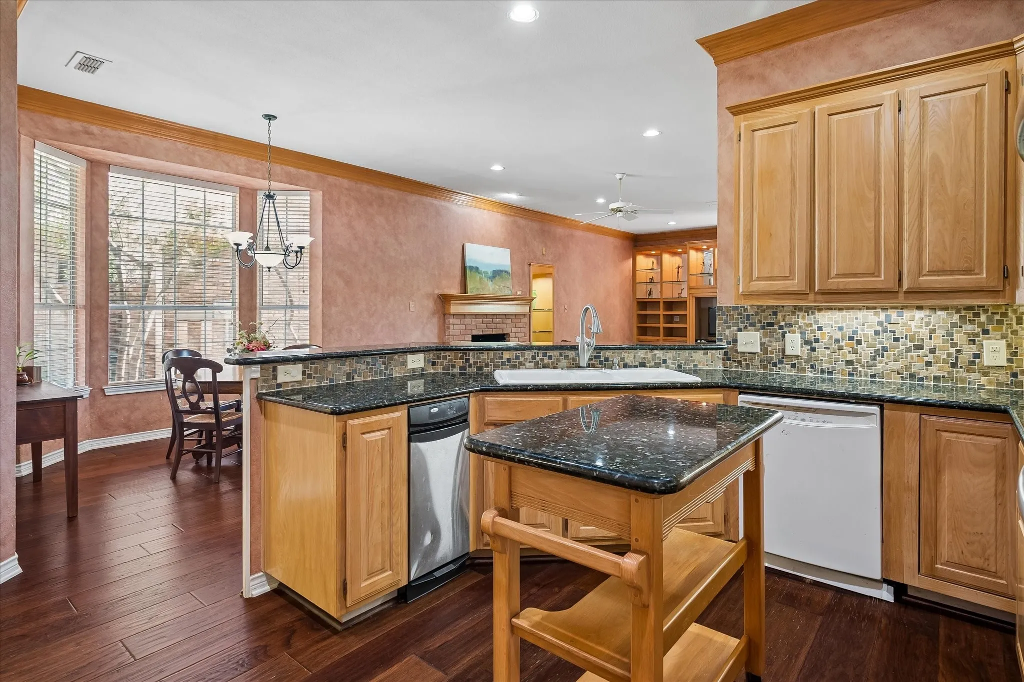Also includes a trash compactor, open viewing to dining and den, and a walk in pantry!