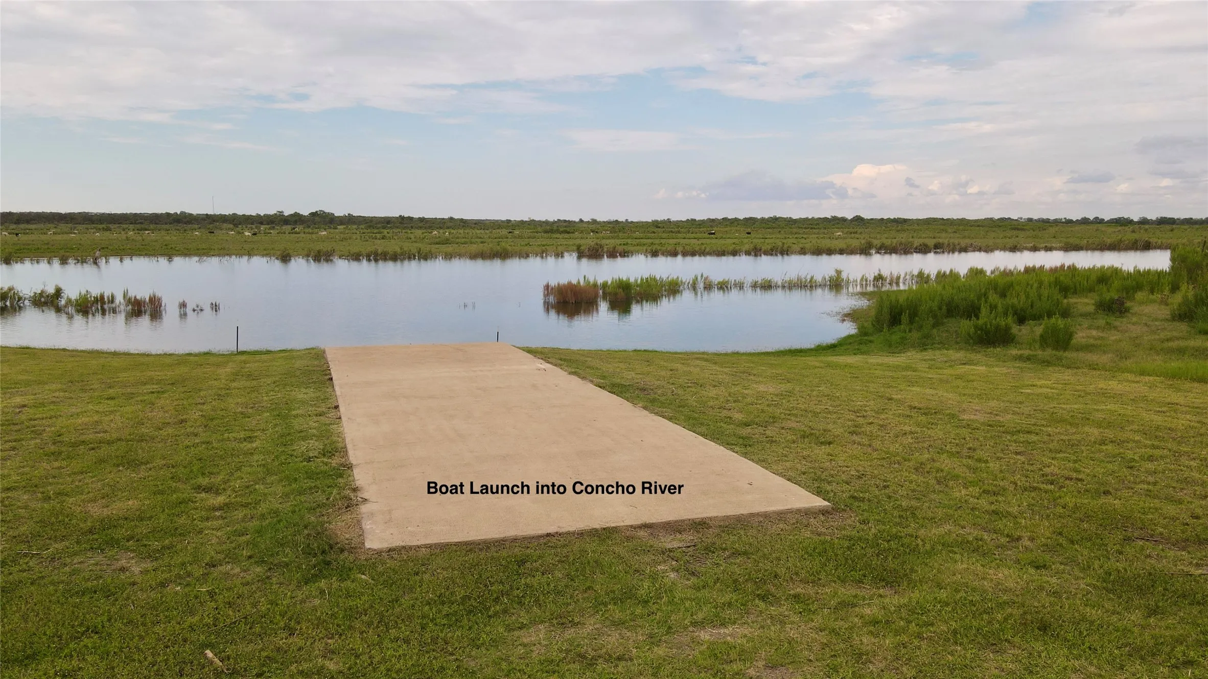 Dock area featuring a water view and a lawn