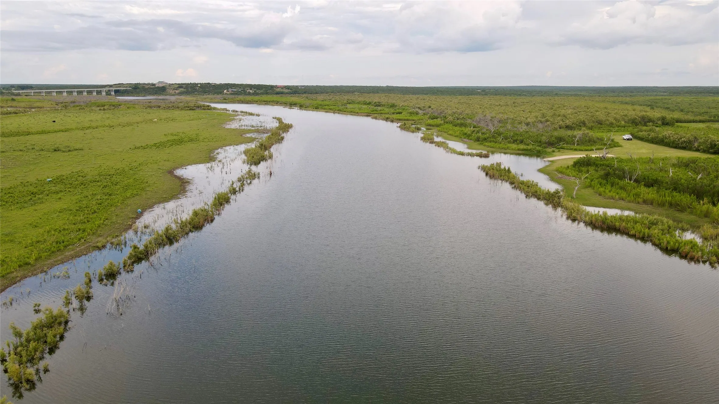 Aerial view of a large body of water and a forest