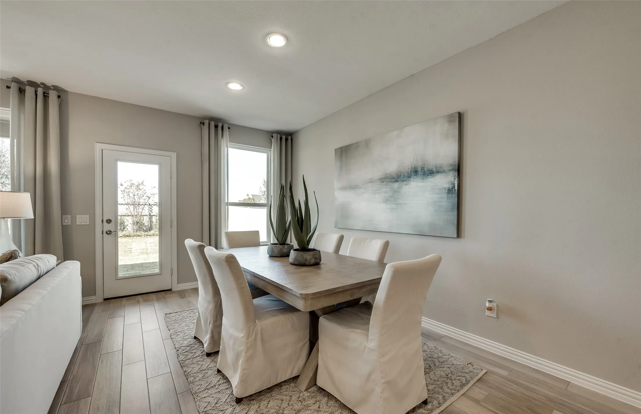 *Model Representation - Dining area off kitchen with large windows