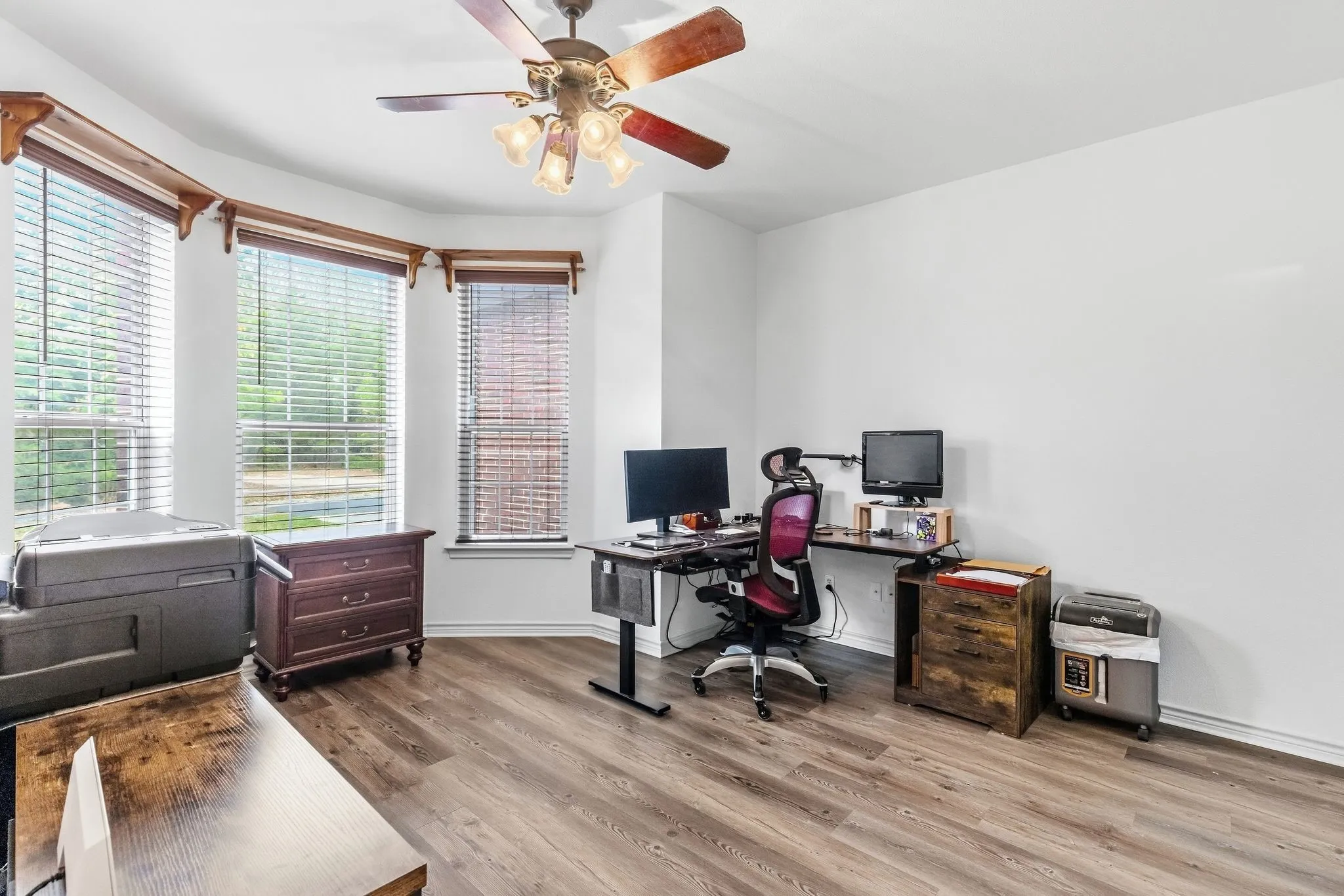 Office with closet and attached bath located downstairs