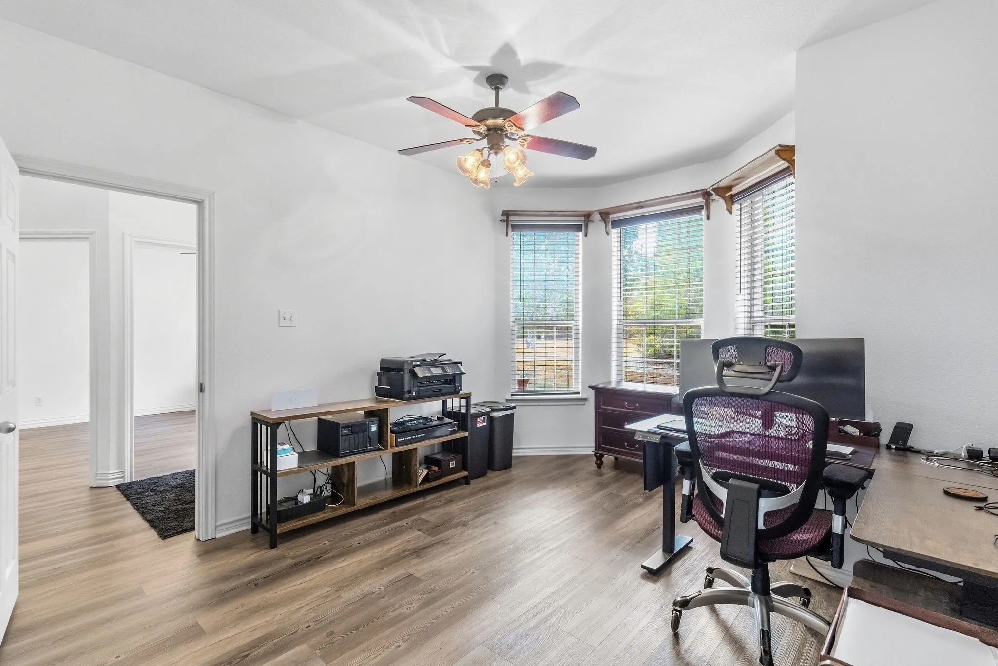 Office with closet and attached bath located downstairs