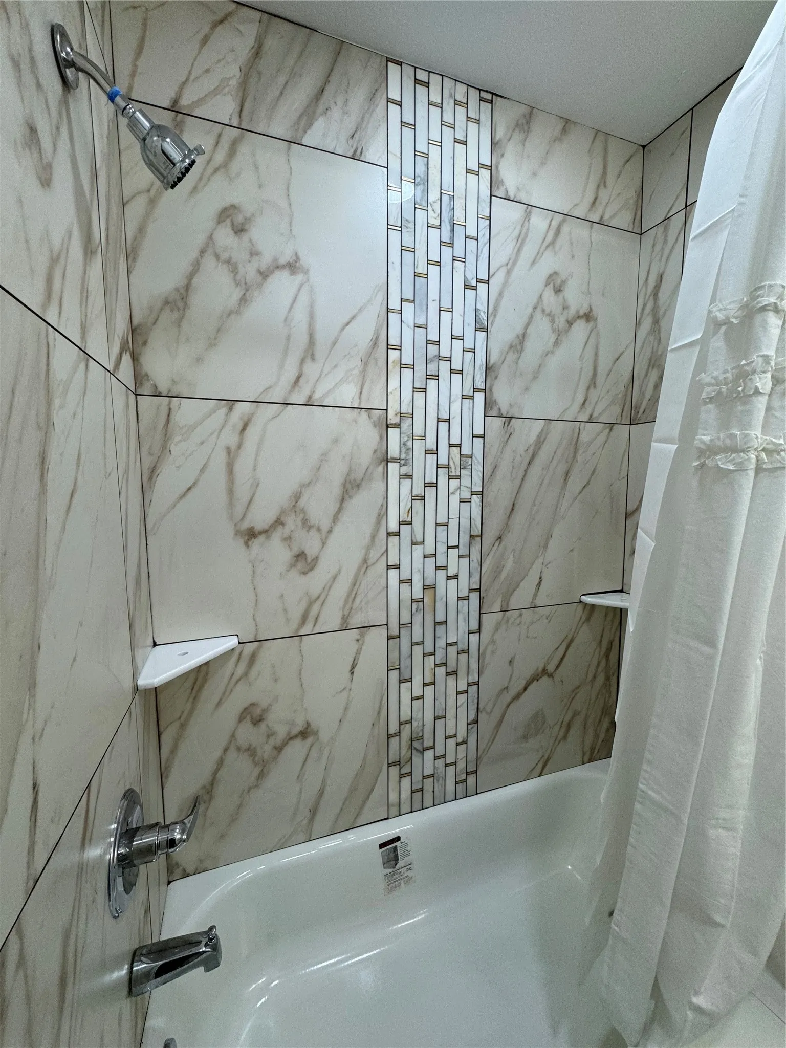 Bathroom featuring shower / bath combination with curtain