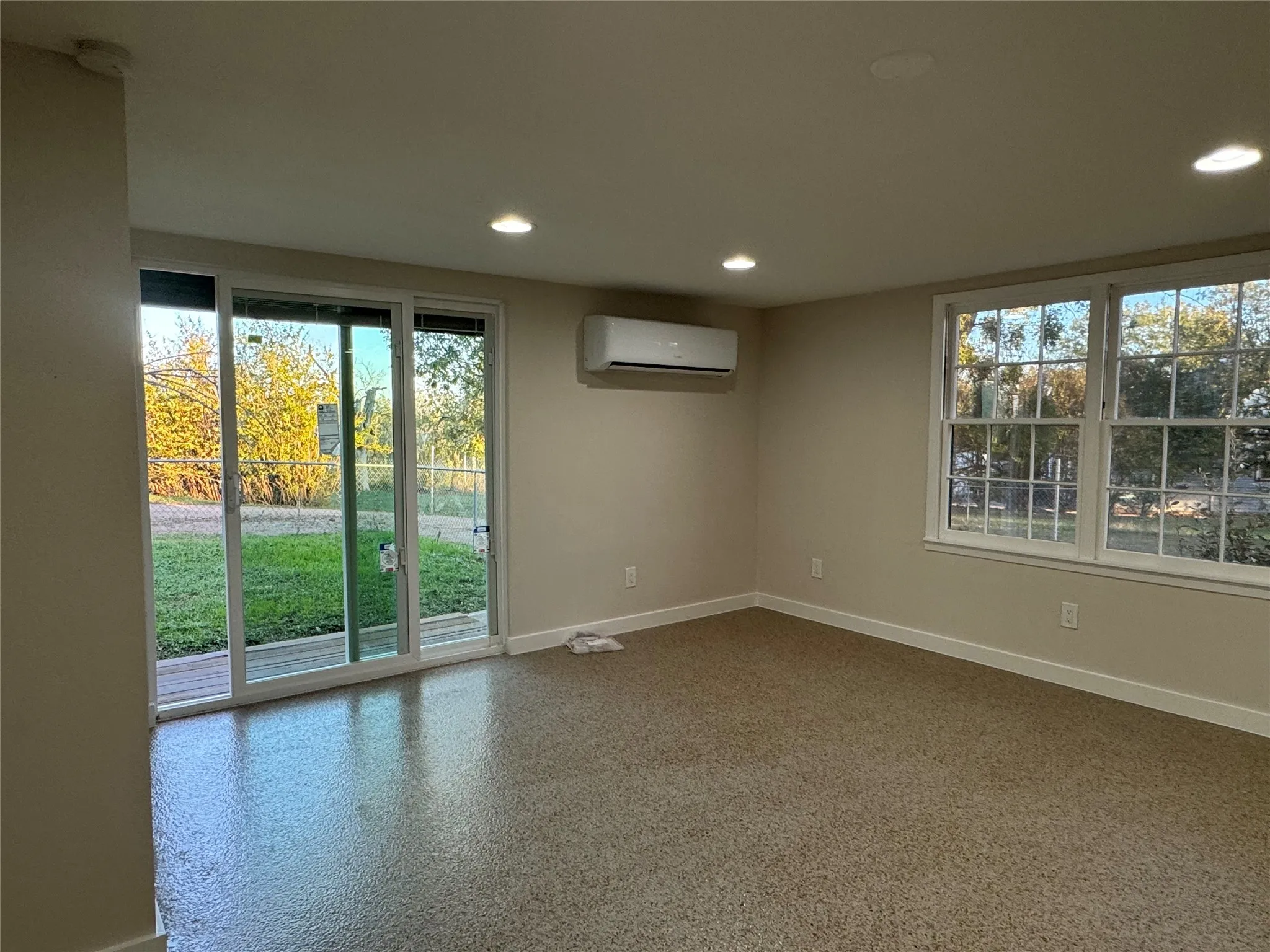 Spare room with a wall mounted air conditioner