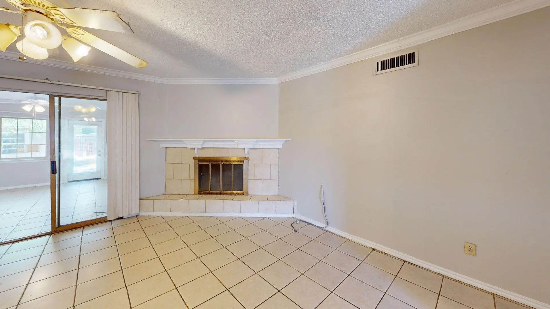 Tiled flooring and a ceiling fan with integrated lighting