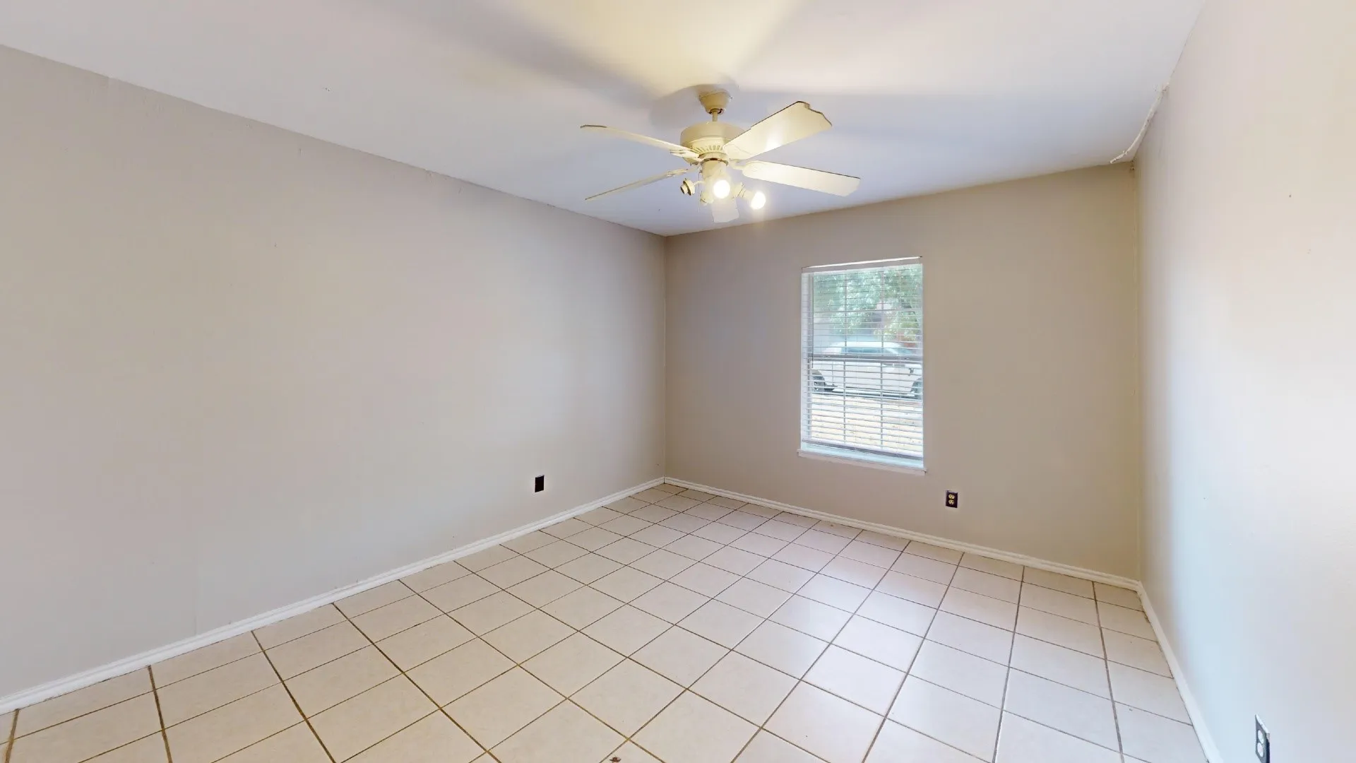 Neutral-toned walls complement the tiled flooring