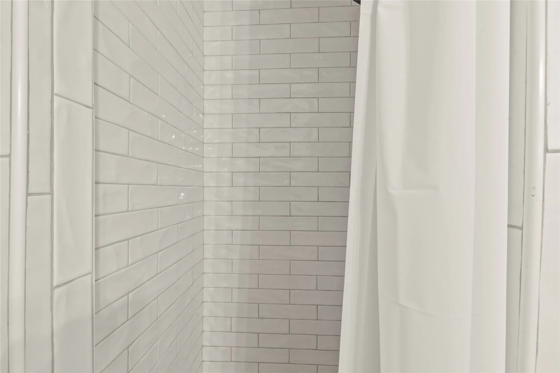 White subway tile shower enclosure
