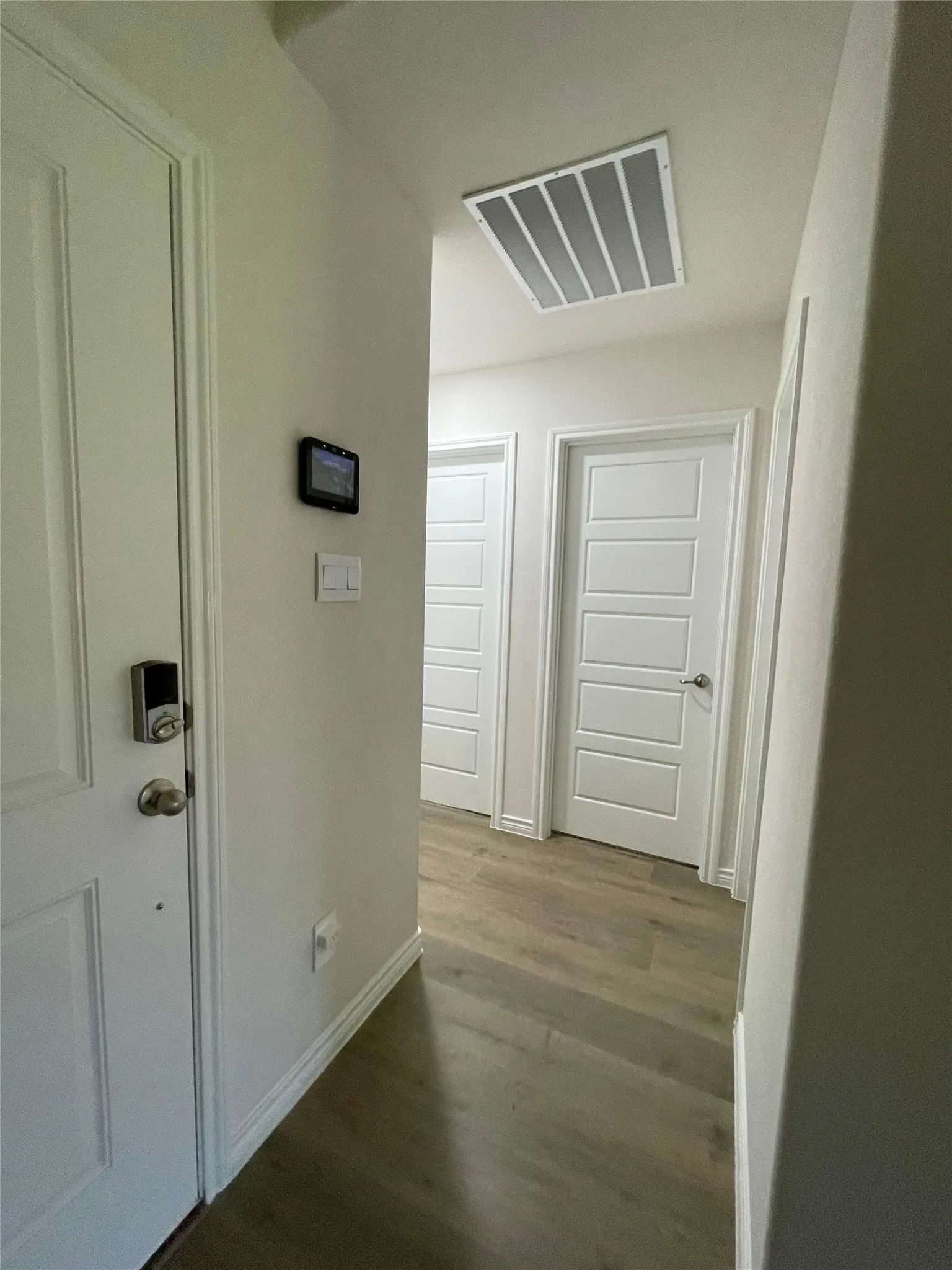 Hall with wood finished floors