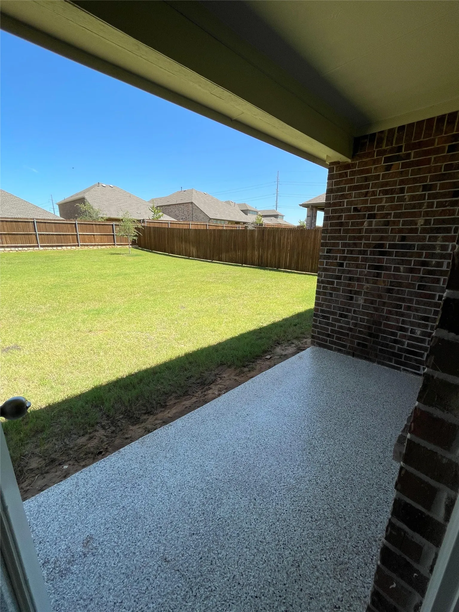 Fenced backyard featuring a patio area