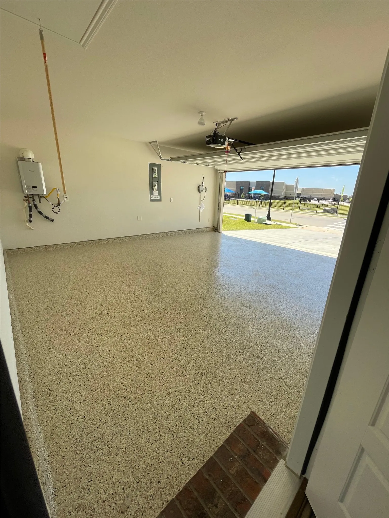 Garage featuring electric panel