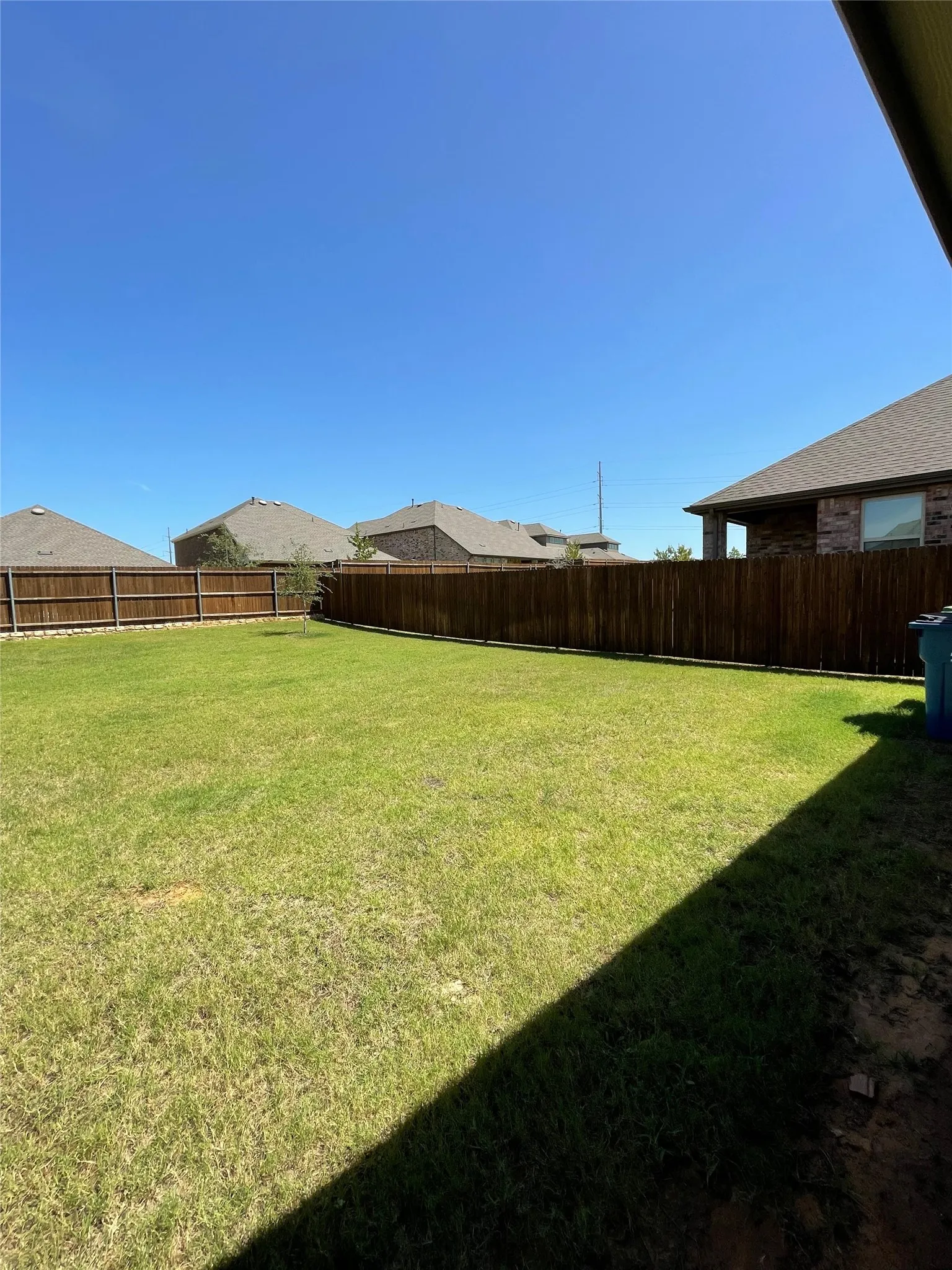 View of fenced backyard