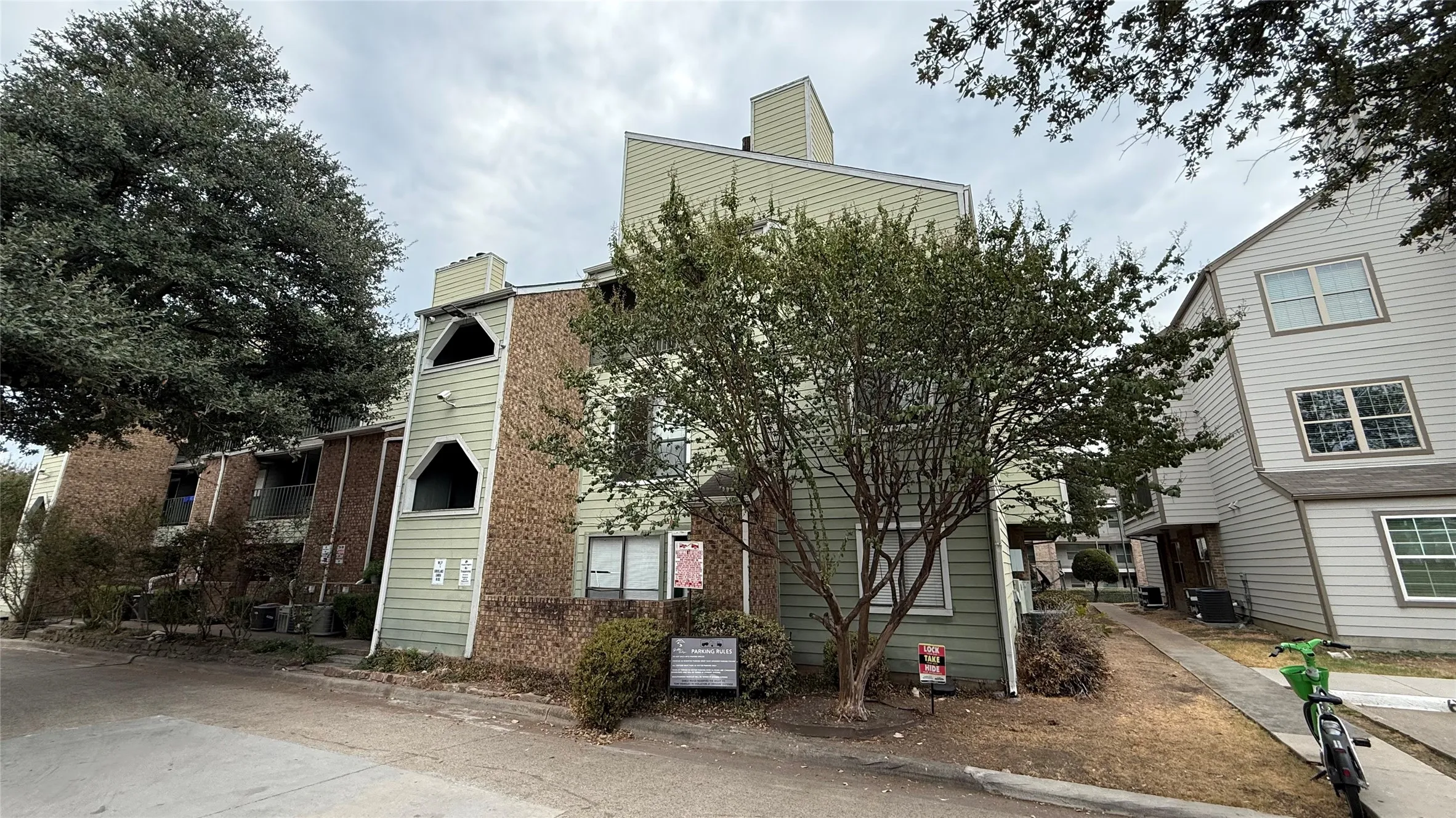 Multi-story building featuring brick and siding exterior construction