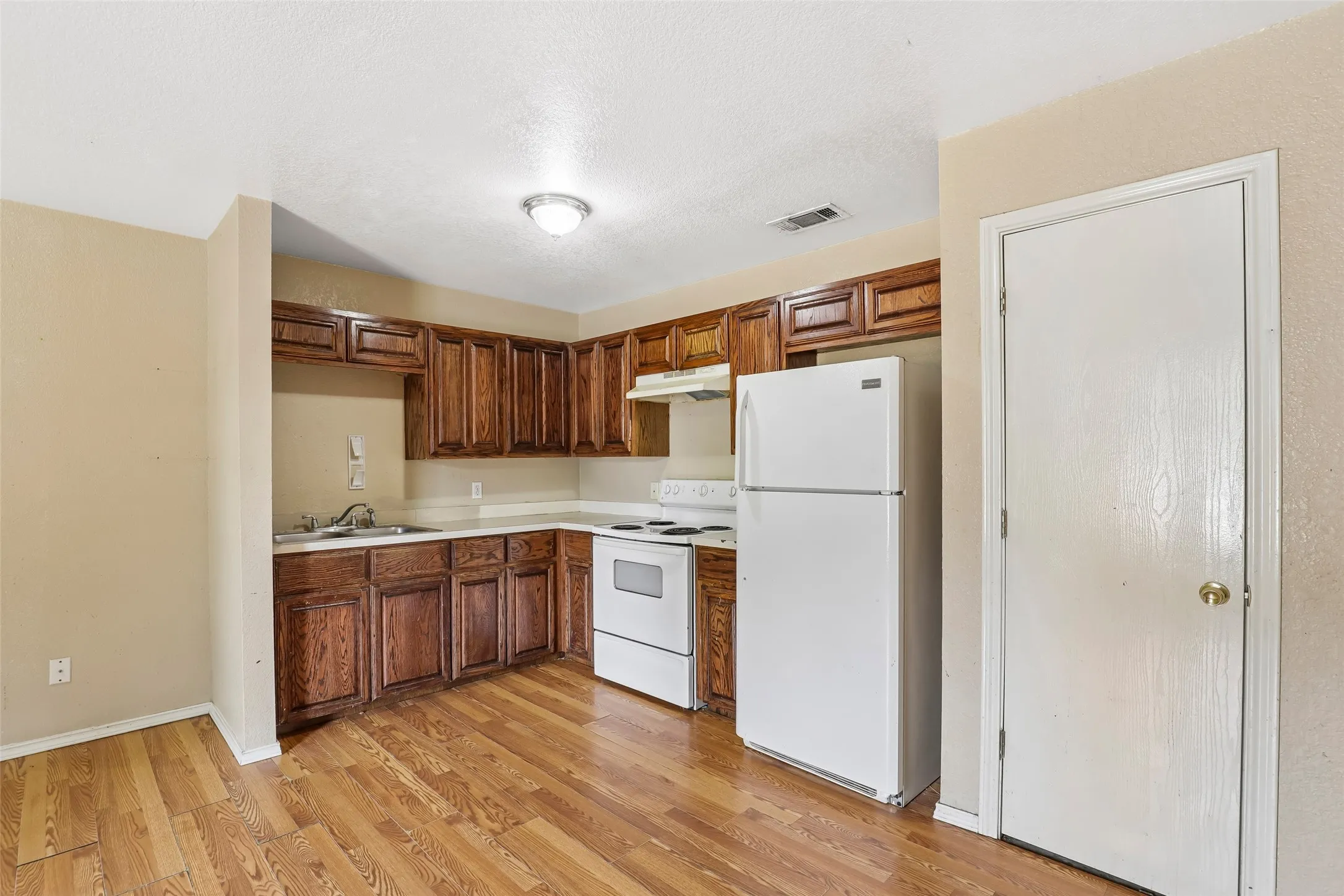 Open kitchen with refrigerator that conveys