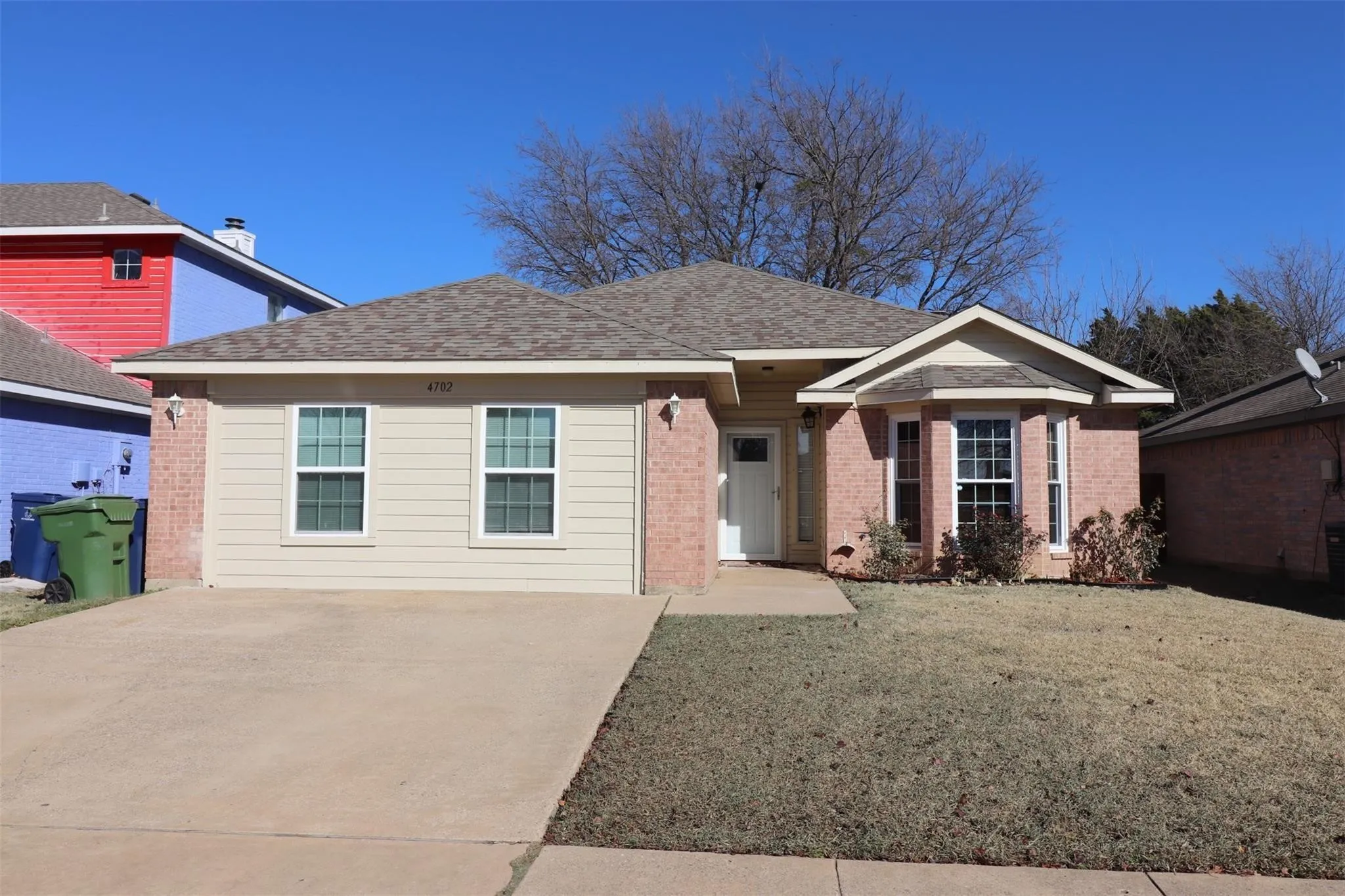Brick and siding exterior with a gabled roof