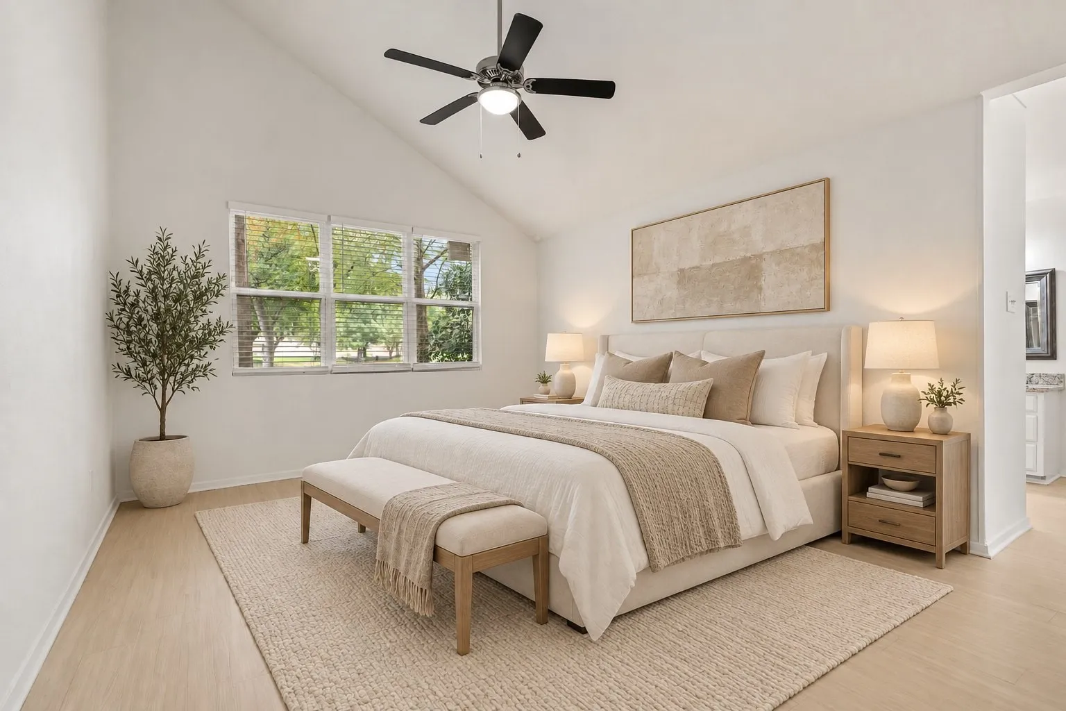 Primary bedroom with vaulted ceiling. Virtually staged.
