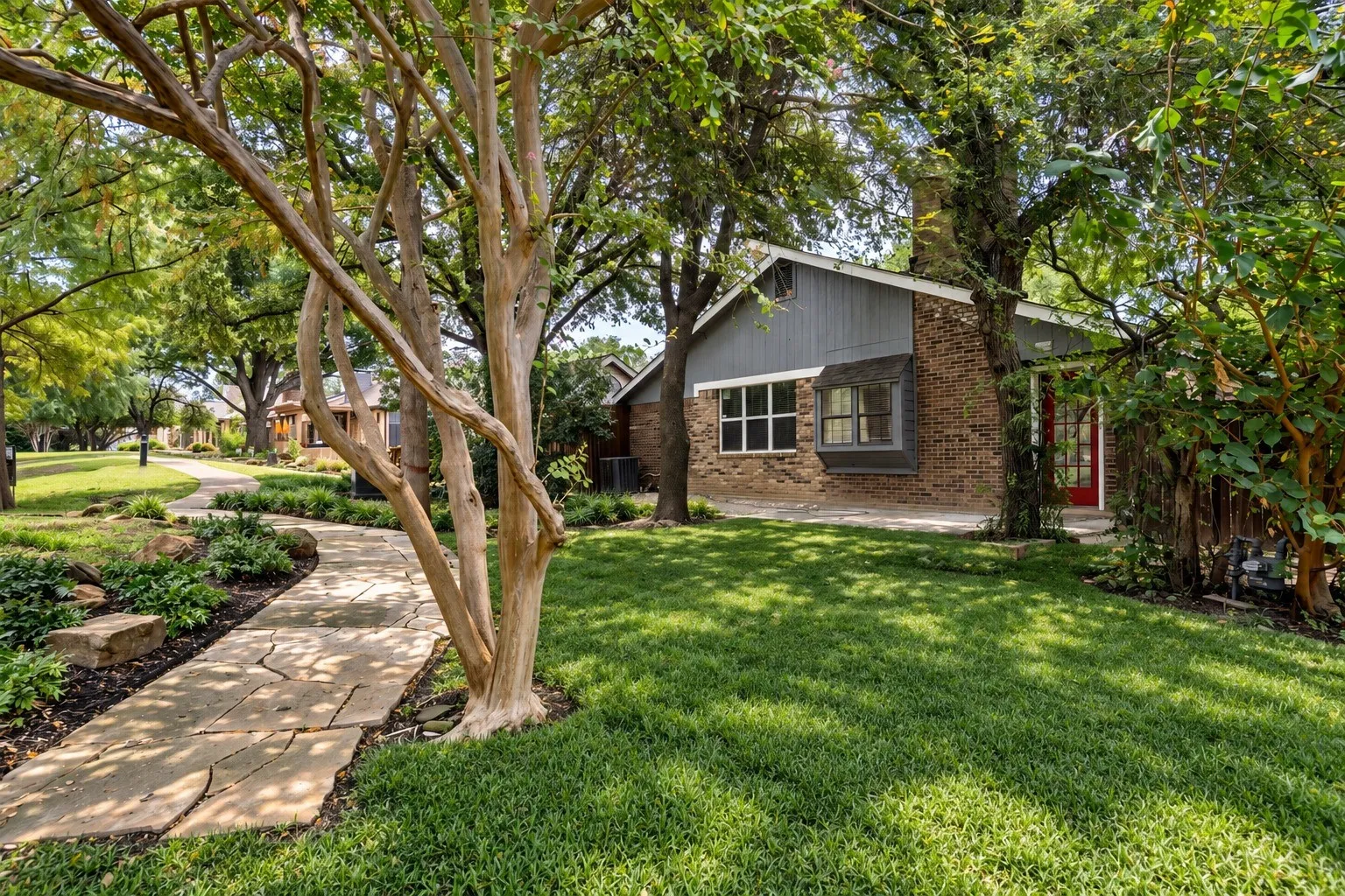 Walkway from the greenbelt to the home.