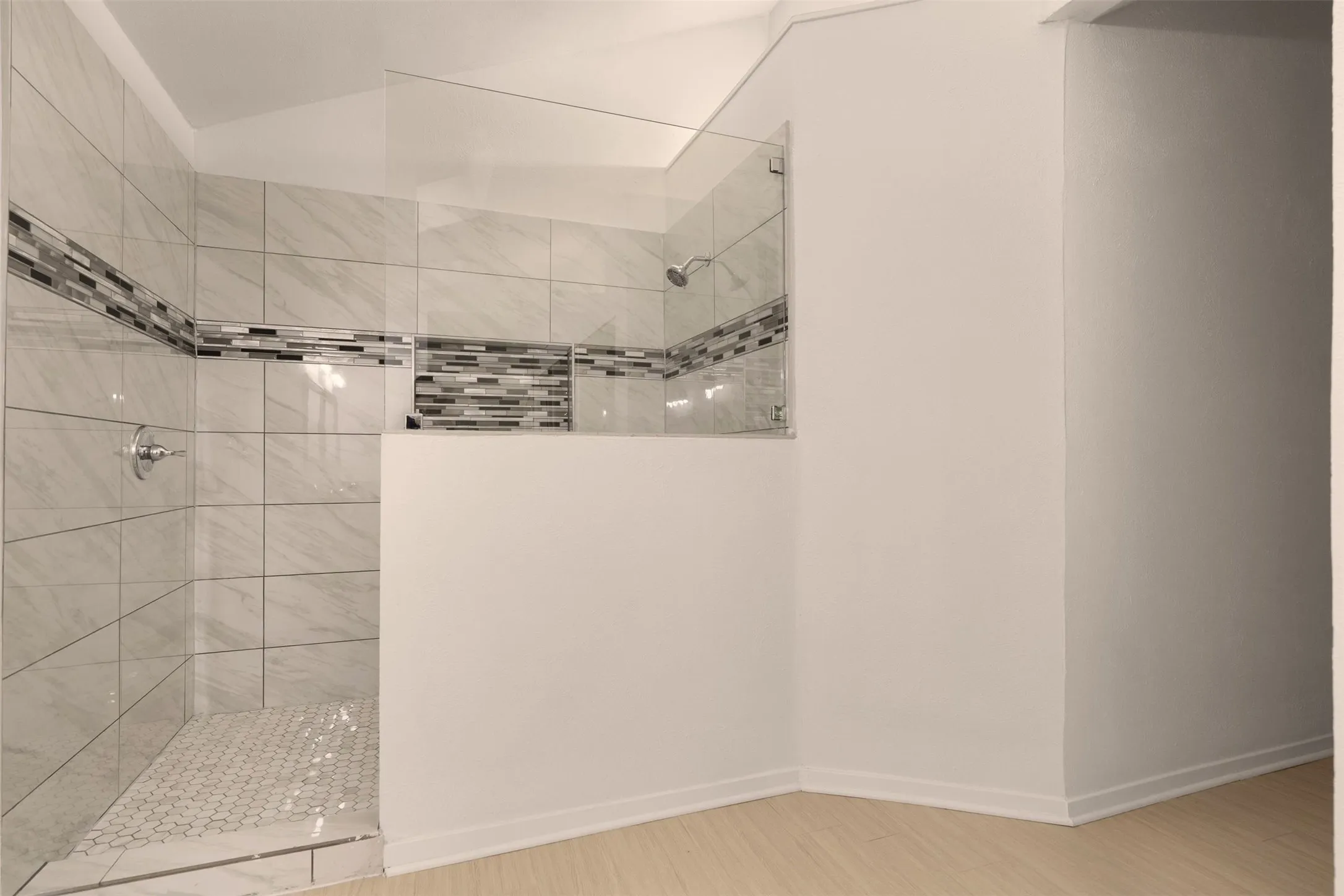 Walk-in tile shower.