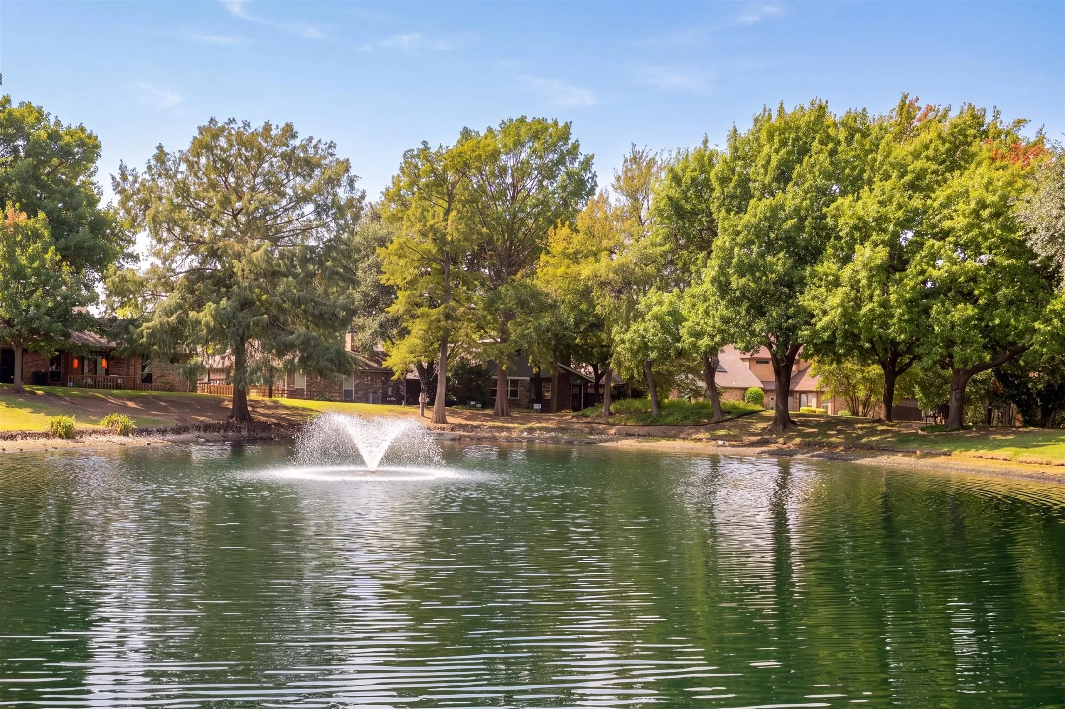 Neighborhood pond with fountain.