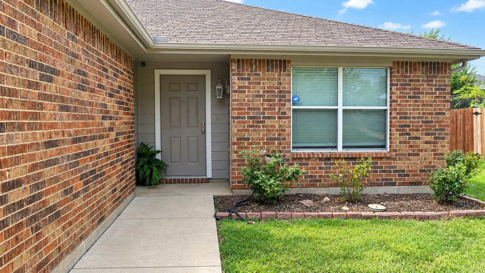 Brick exterior construction with a gabled roof
