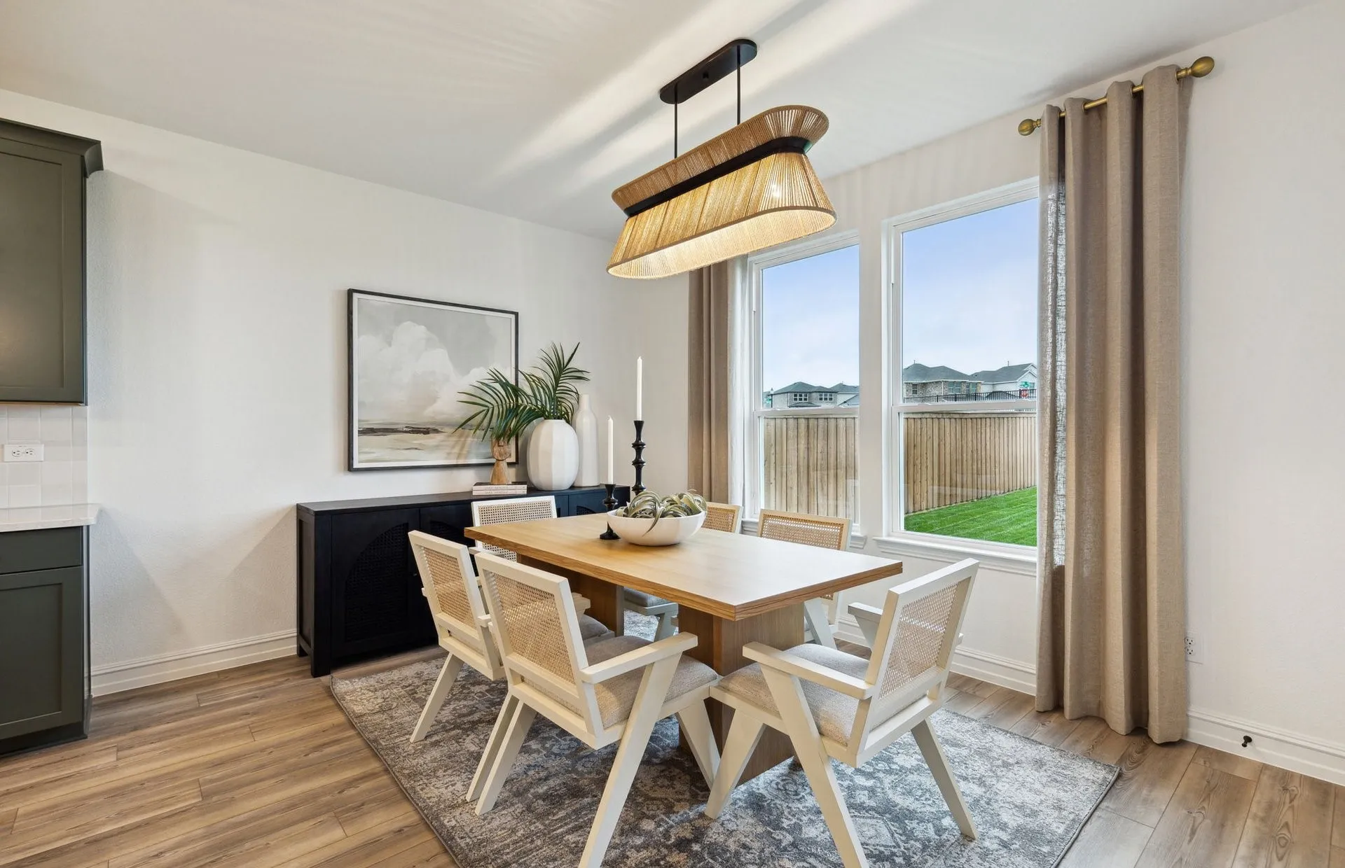 *Model Representation - Dining area off kitchen with large windows