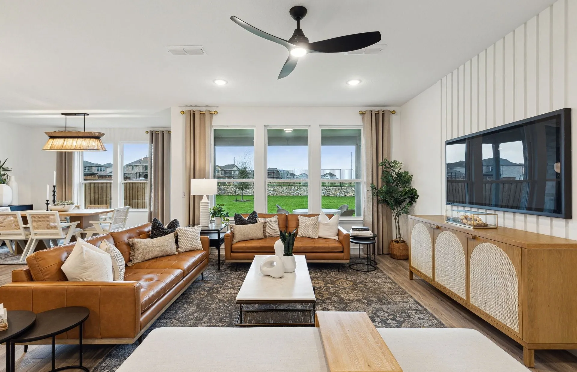 *Model Representation - Spacious gathering room with large windows