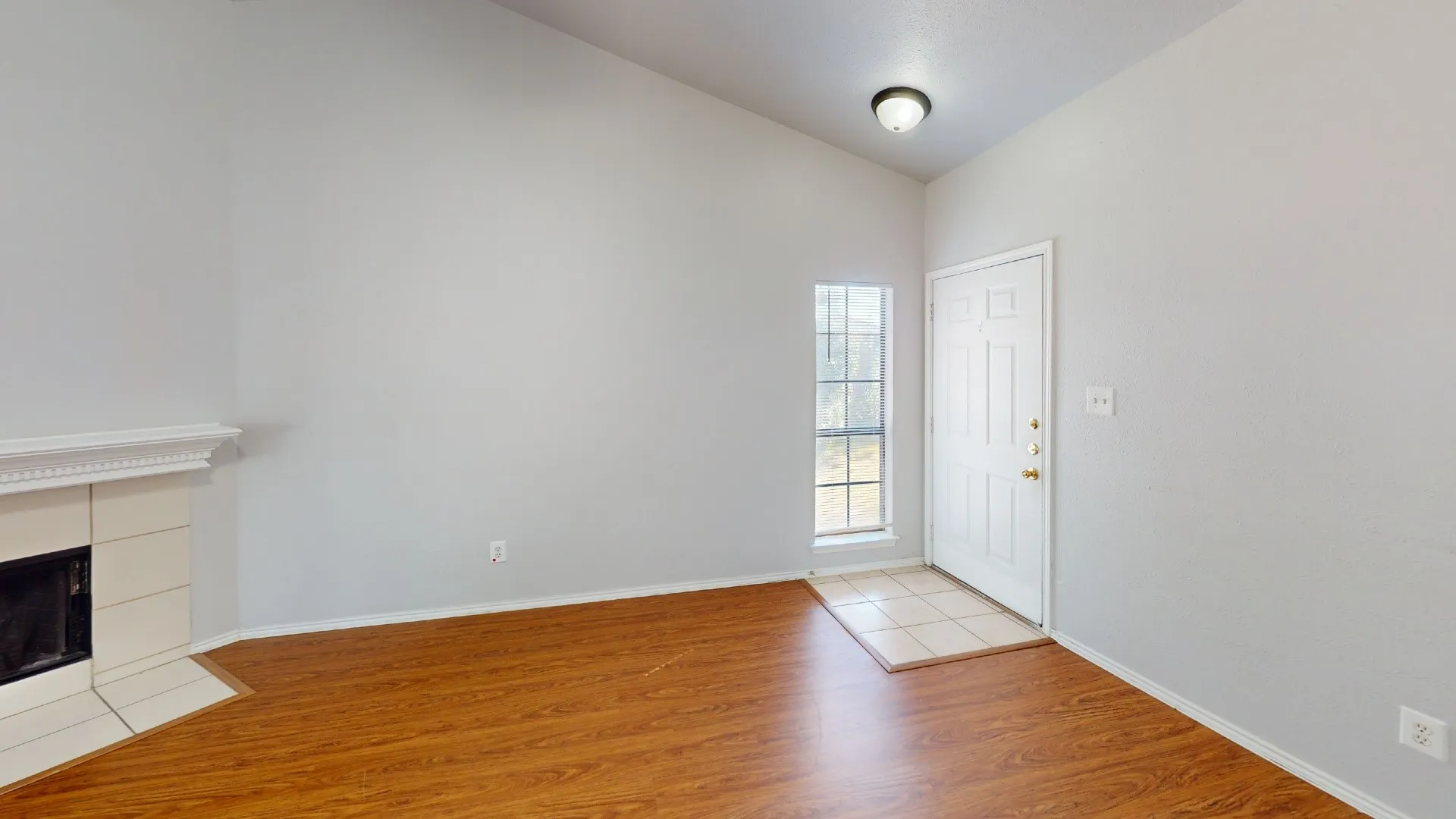 Vaulted ceiling with a flush-mount light fixture