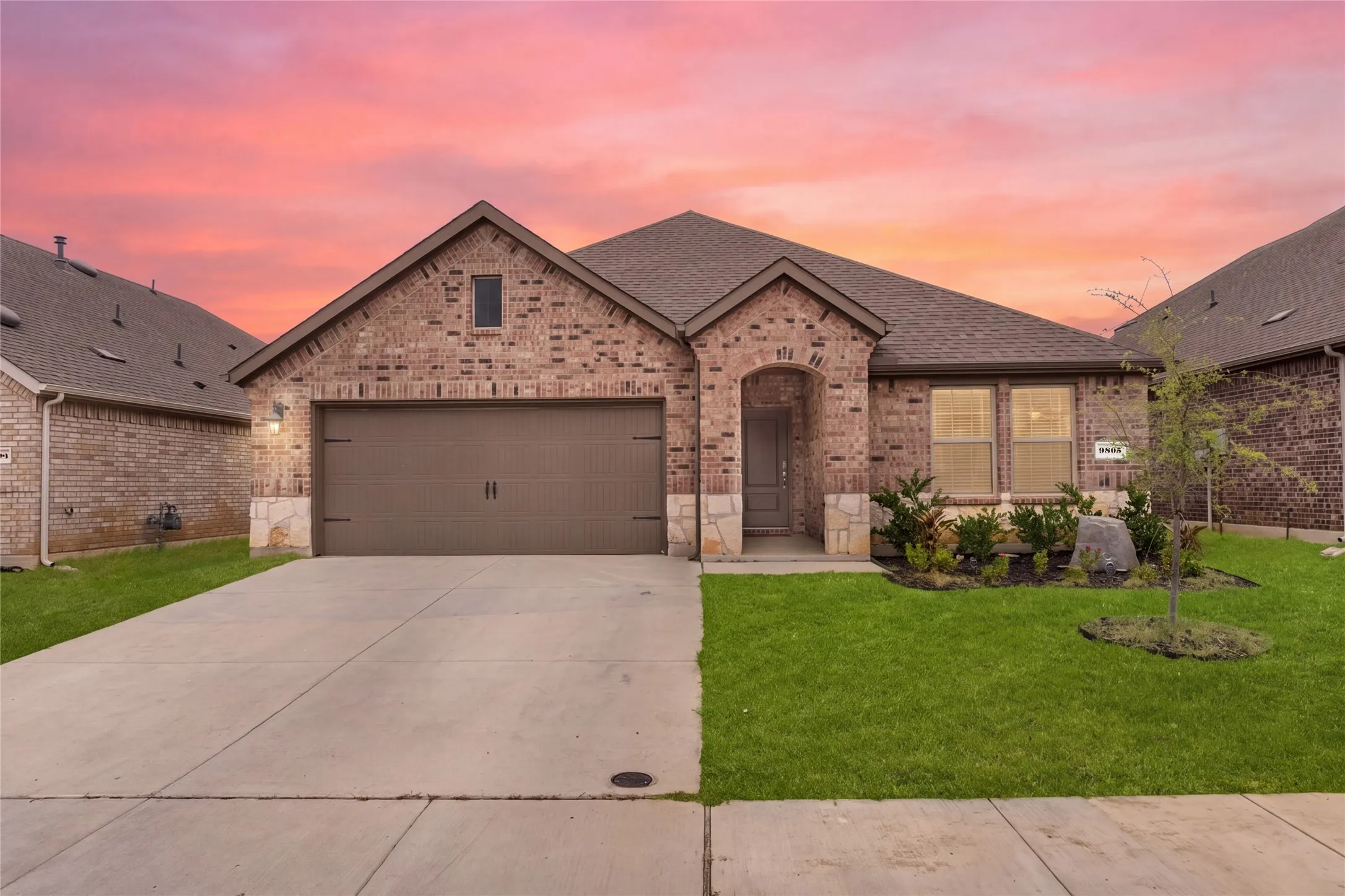 Brick and stone veneer exterior with a gabled roof