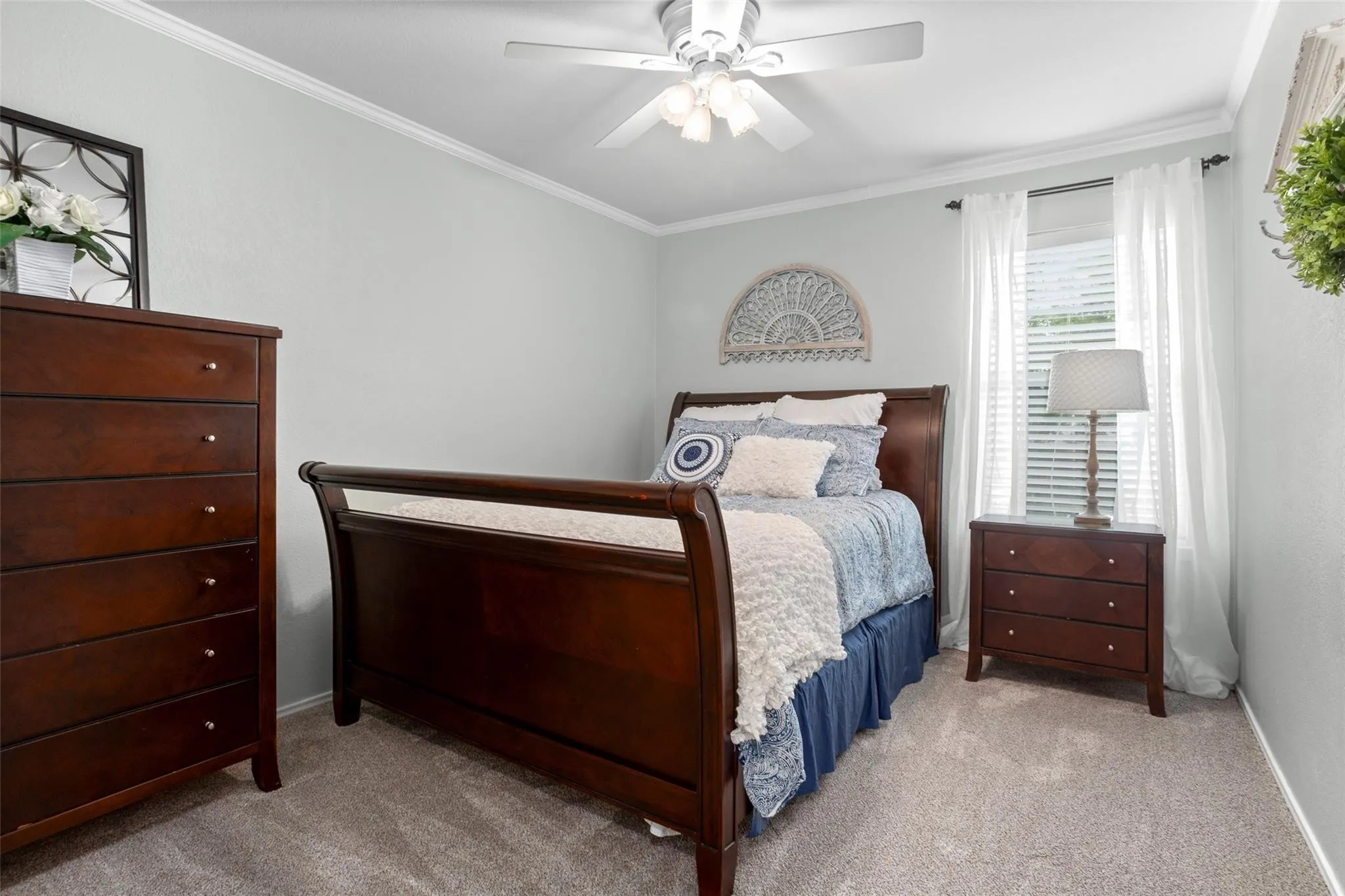 Crown molding and a ceiling fan with integrated lighting