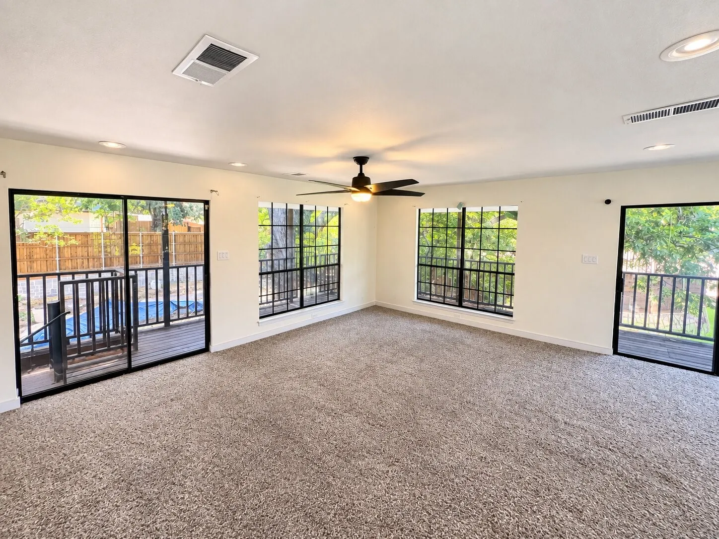 Recessed lighting throughout, ceiling fan, and carpeted flooring