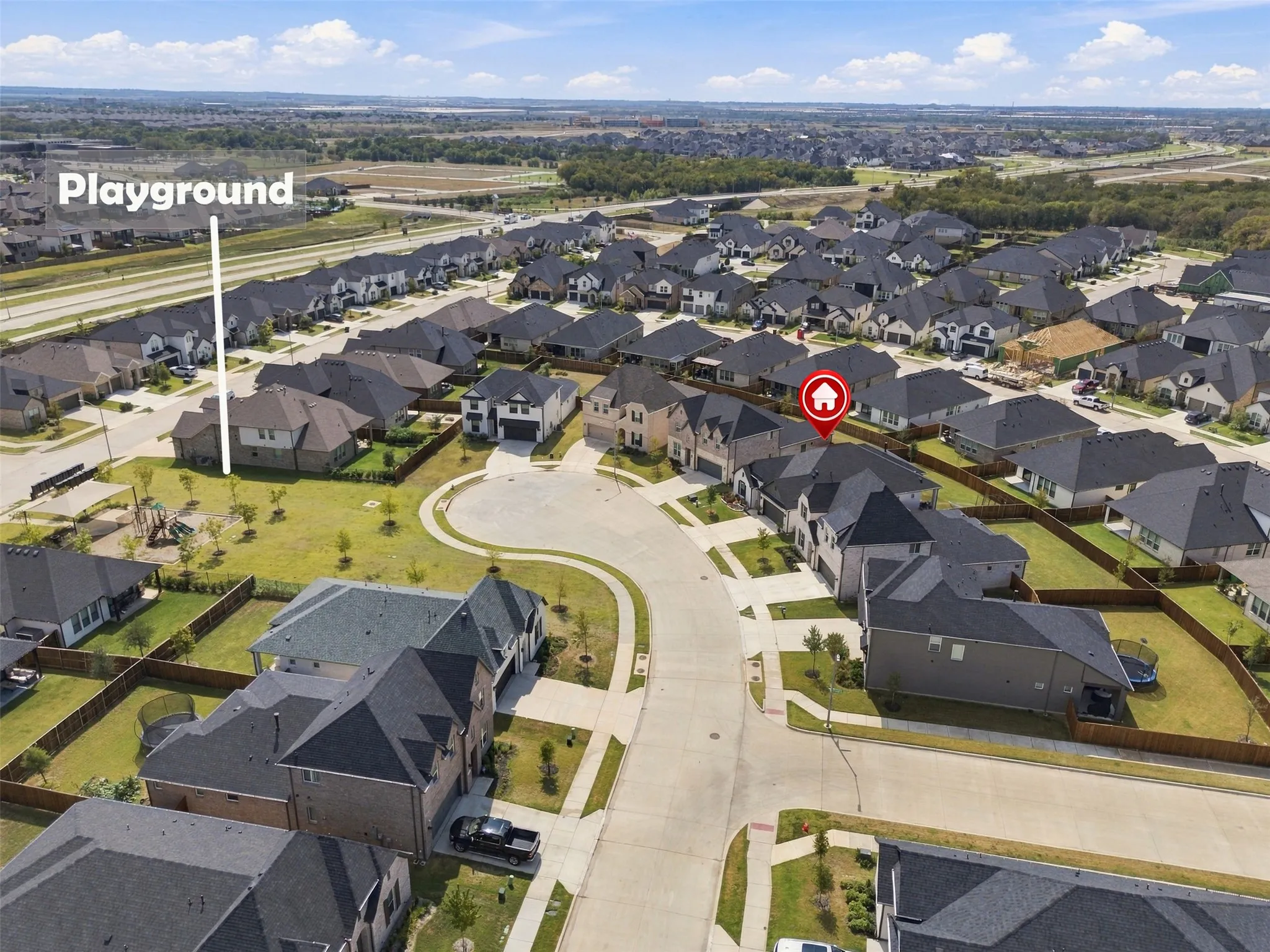 Modern suburban neighborhood with consistent architectural styles and dark-toned roofs