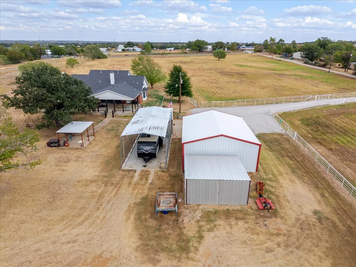 Workshop, Second covered pavilion on slab,  Covered RV carport with plugs, additional storage building for tractor or other implements - what more could you need ?!