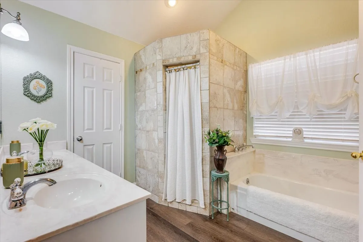 Double sinks, separate tiled shower, soaking tub, private water closet, double walk in closets