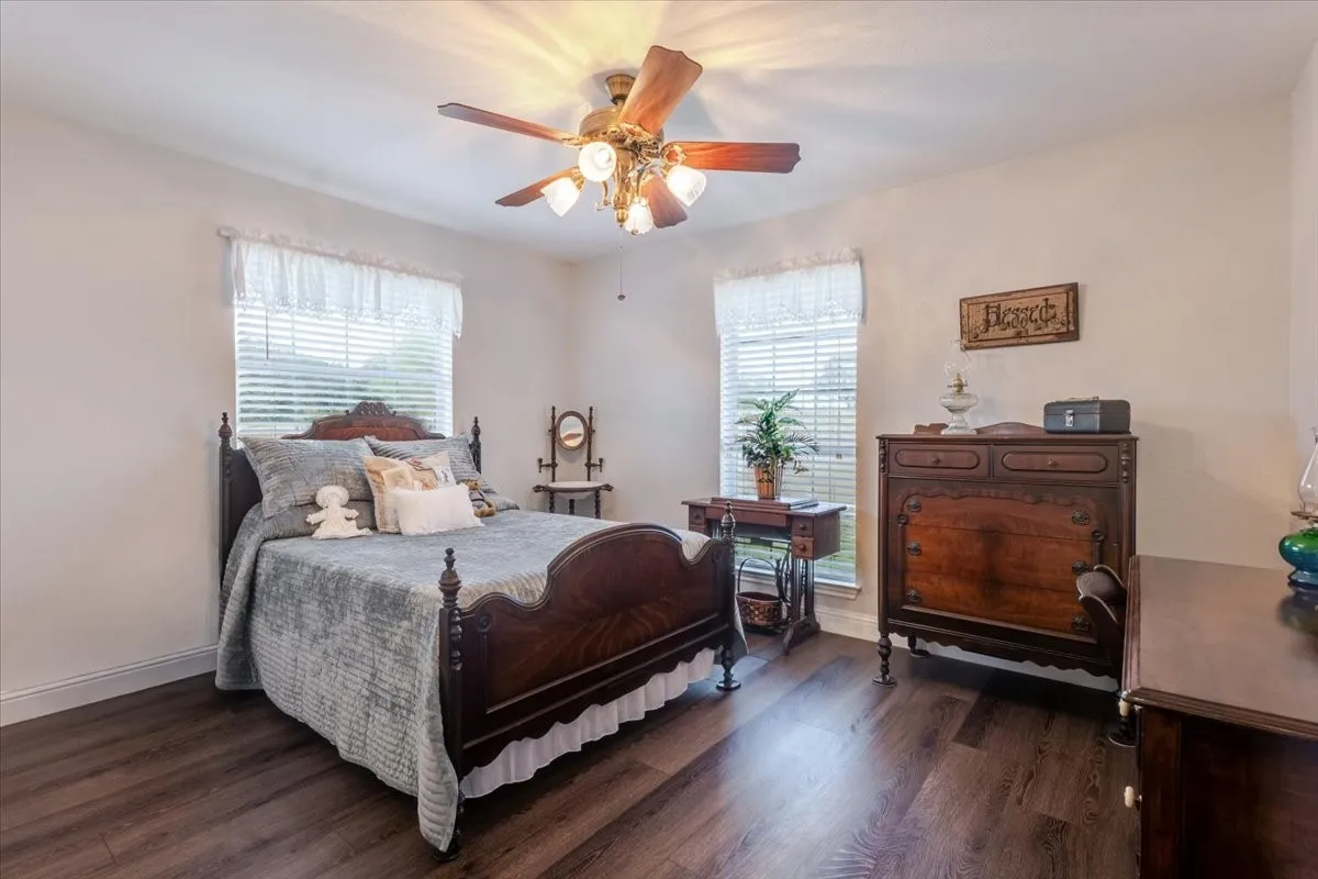 Additional secondary bedroom with a built in desk perfect as a vanity or study space